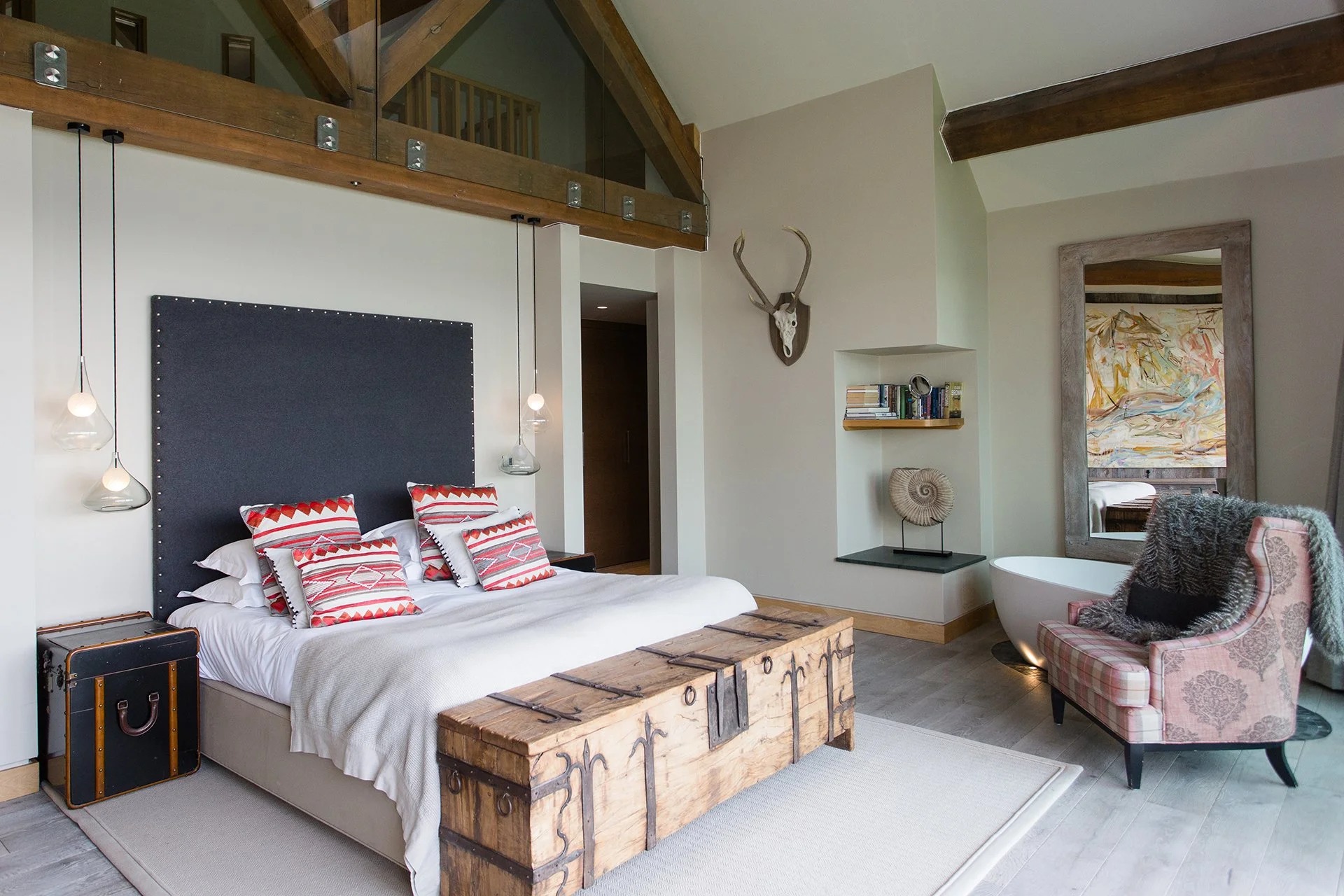 A bespoke glass and stainless steel staircase leads to five en-suite bedrooms with floor-to-ceiling windows, four of which have uninterrupted lake views three have balconies. Each has a ViSpring bed, two of which can be made up as twins.