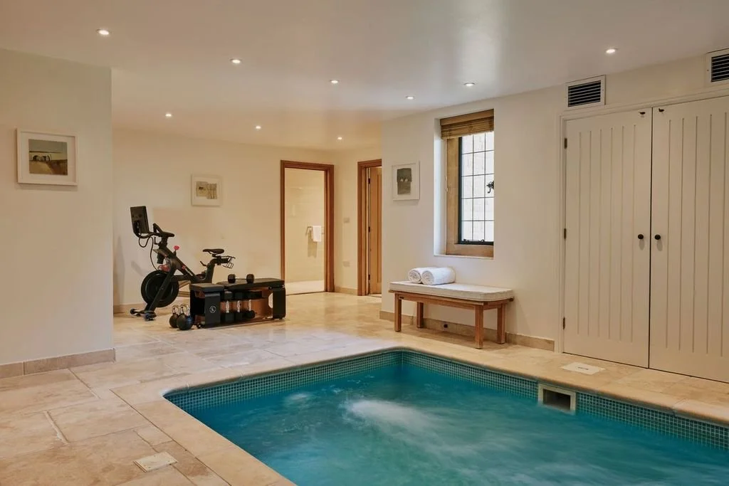 The lower ground floor has an indoor swim jet heated pool and an ample relaxation area. 