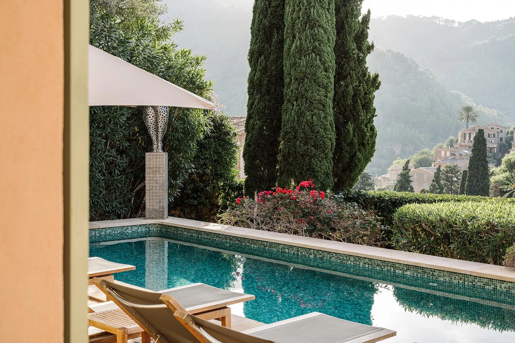 pool loungers terrace trees