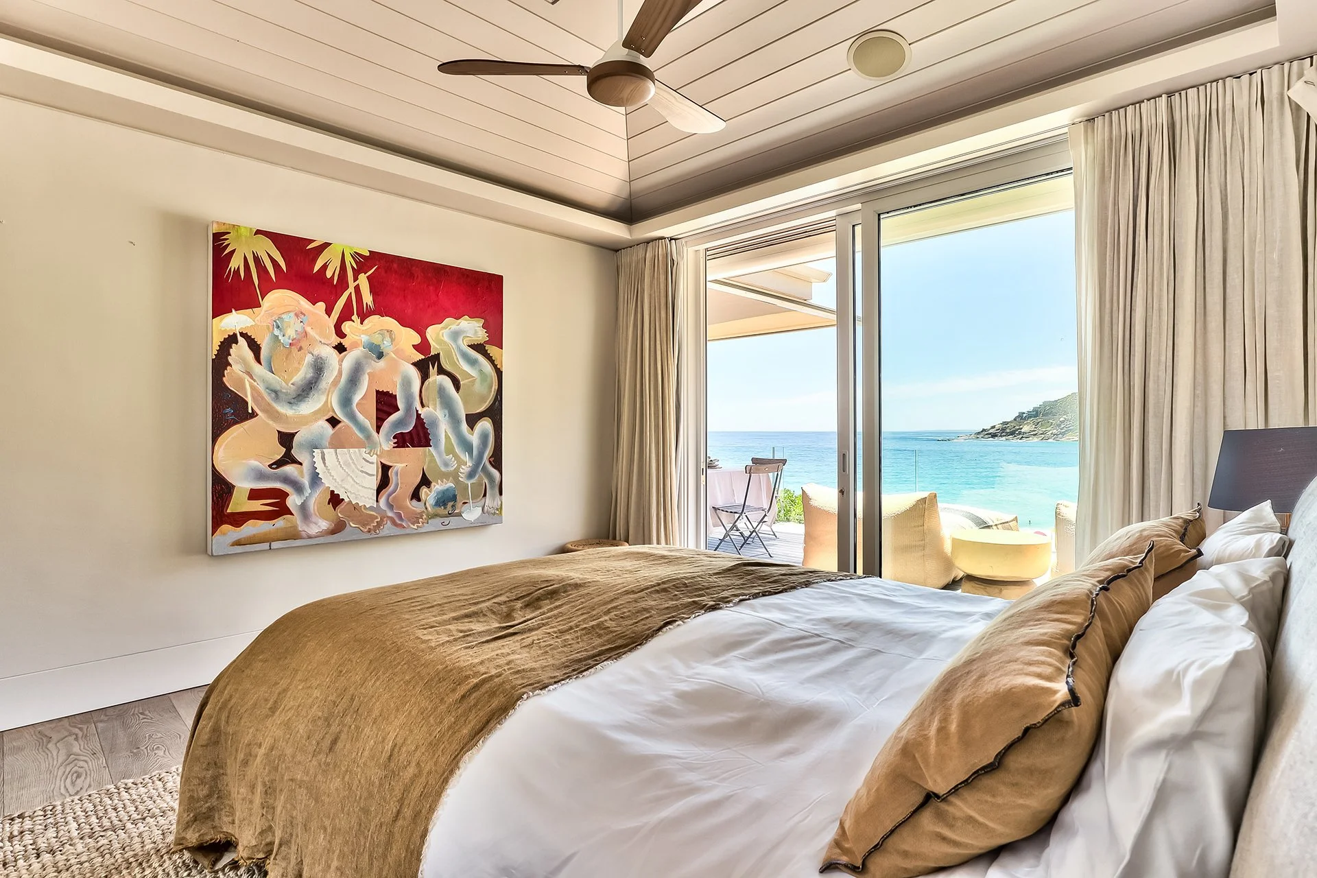 Each of the three bedrooms has an en suite bathroom, king-size bed and access to outside decked areas through floor-to-ceiling windows. The master bedroom has a spacious bathroom with two sinks, shower and contemporary freestanding oval bath.