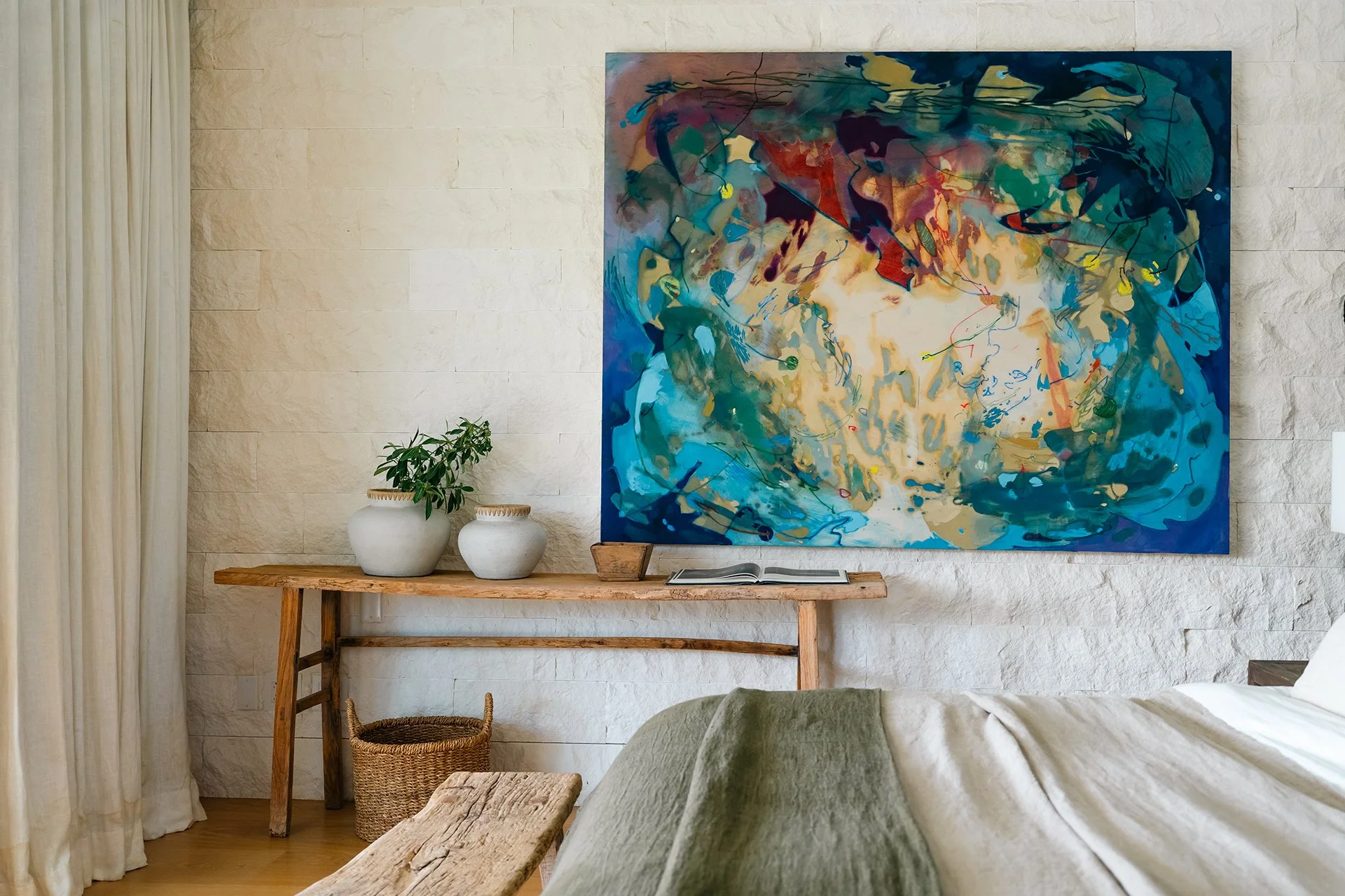 A double staircase with feature Verpan seashell chandelier leads upstairs to five spacious en suite bedrooms, some with four-poster beds; all with American oak flooring, Ralph Lauren bed stools and other unique design pieces.