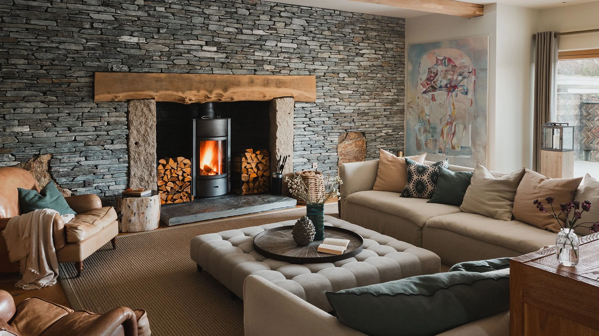 The living room’s homely feel is boosted by its Stuv woodburner, inviting sofas and luxury linens, leather and wood. A large round games table is perfect for late-night Scrabble and Monopoly marathons. Enquire now for a stay at Little Polgarron.