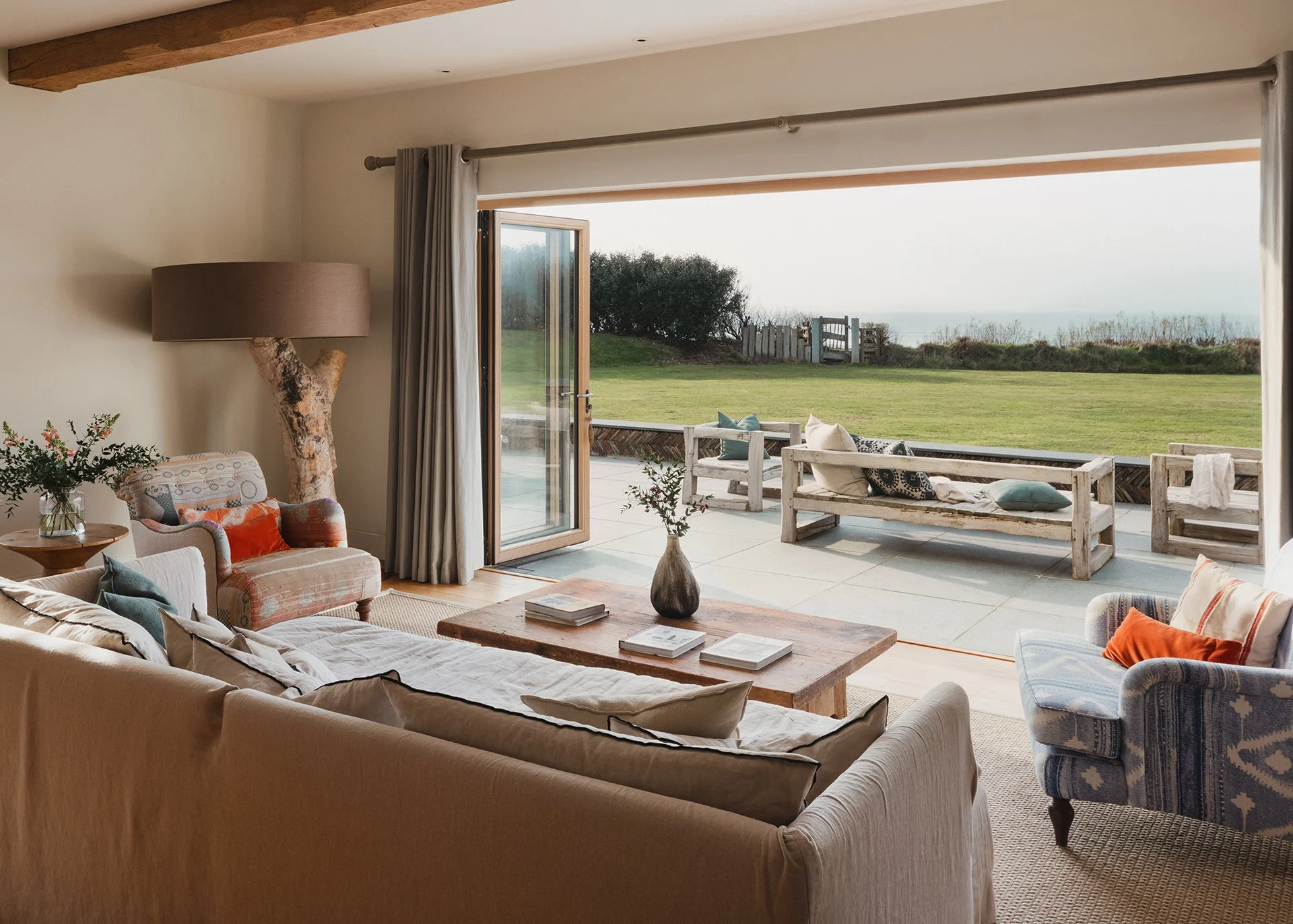 The living room’s homely feel is boosted by its Stuv woodburner, inviting sofas and luxury linens, leather and wood. A large round games table is perfect for late-night Scrabble and Monopoly marathons.