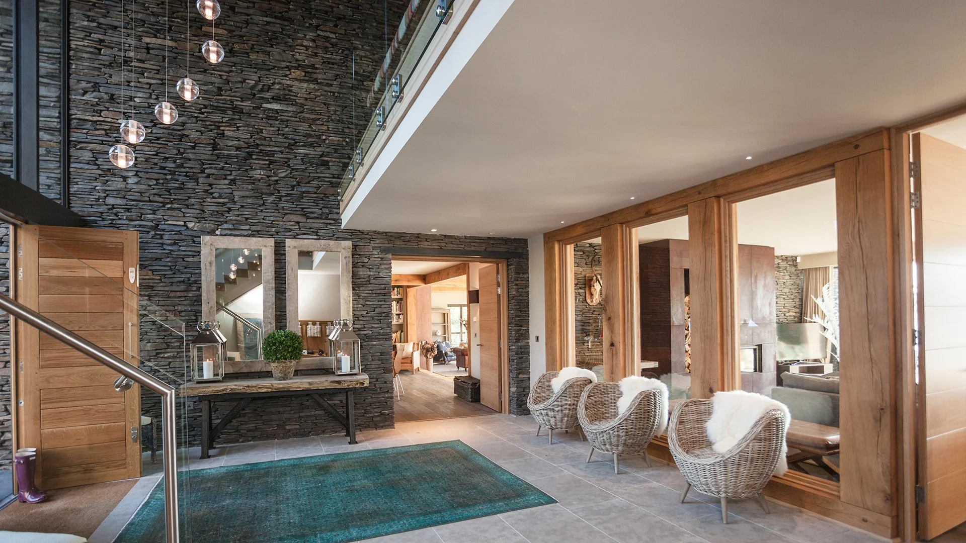 The lake house sleeps up to 10 guests in five bedrooms with interiors features such as decorative antlers, warm plaid fabrics and faux fur rugs contributing to its hunting lodge vibe. Book a luxury staycation now. 