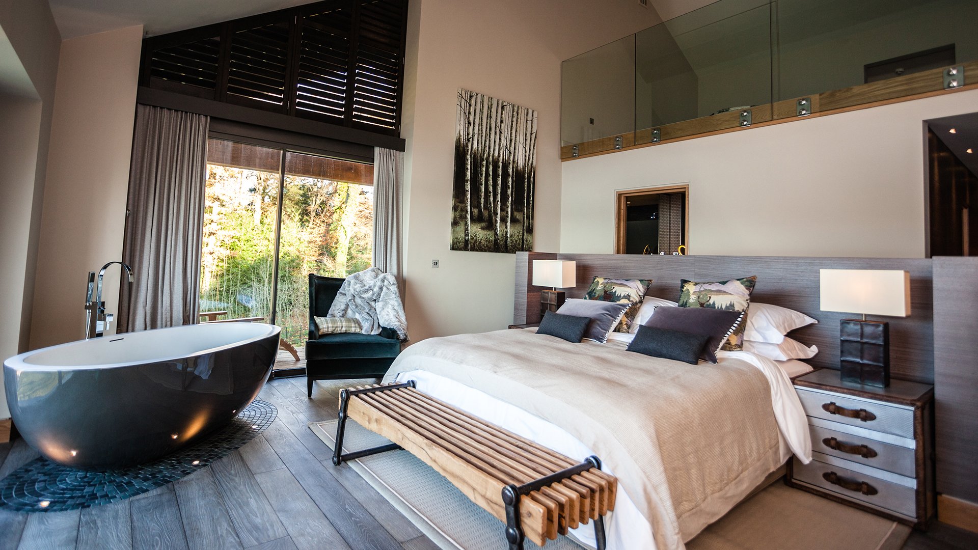 A bespoke glass and stainless steel staircase leads to five en-suite bedrooms with floor-to-ceiling windows, four of which have uninterrupted lake views. The perfect destination for a wellness retreat, make an enquiry for Grey Gables. 