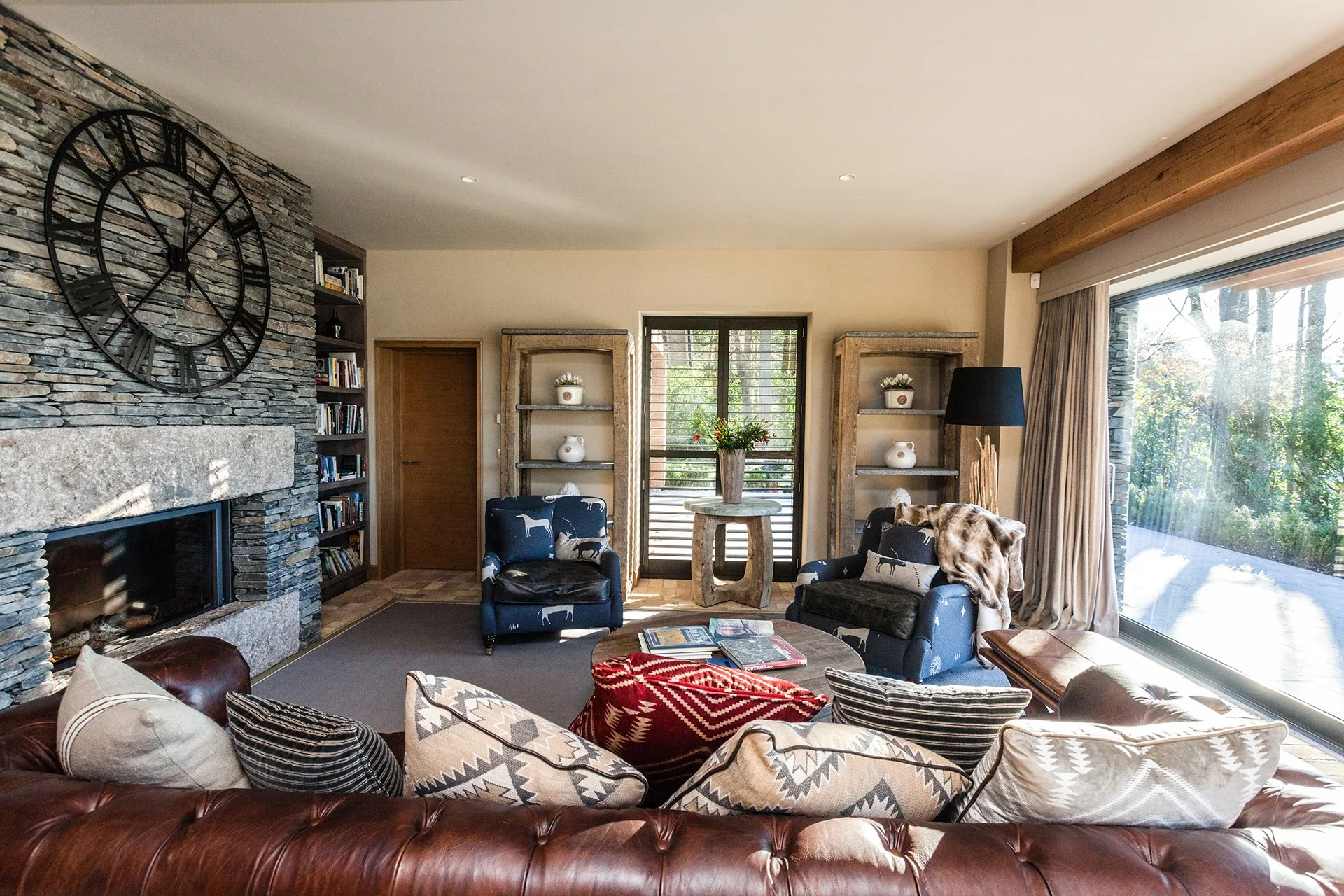 The spacious, open-plan living area features a high-spec kitchen, impressive dining table and living area with Stuv woodburner faced with local Burlington Stone. The main lounge with woodburner and additional snug are ideal for cosy nights in.