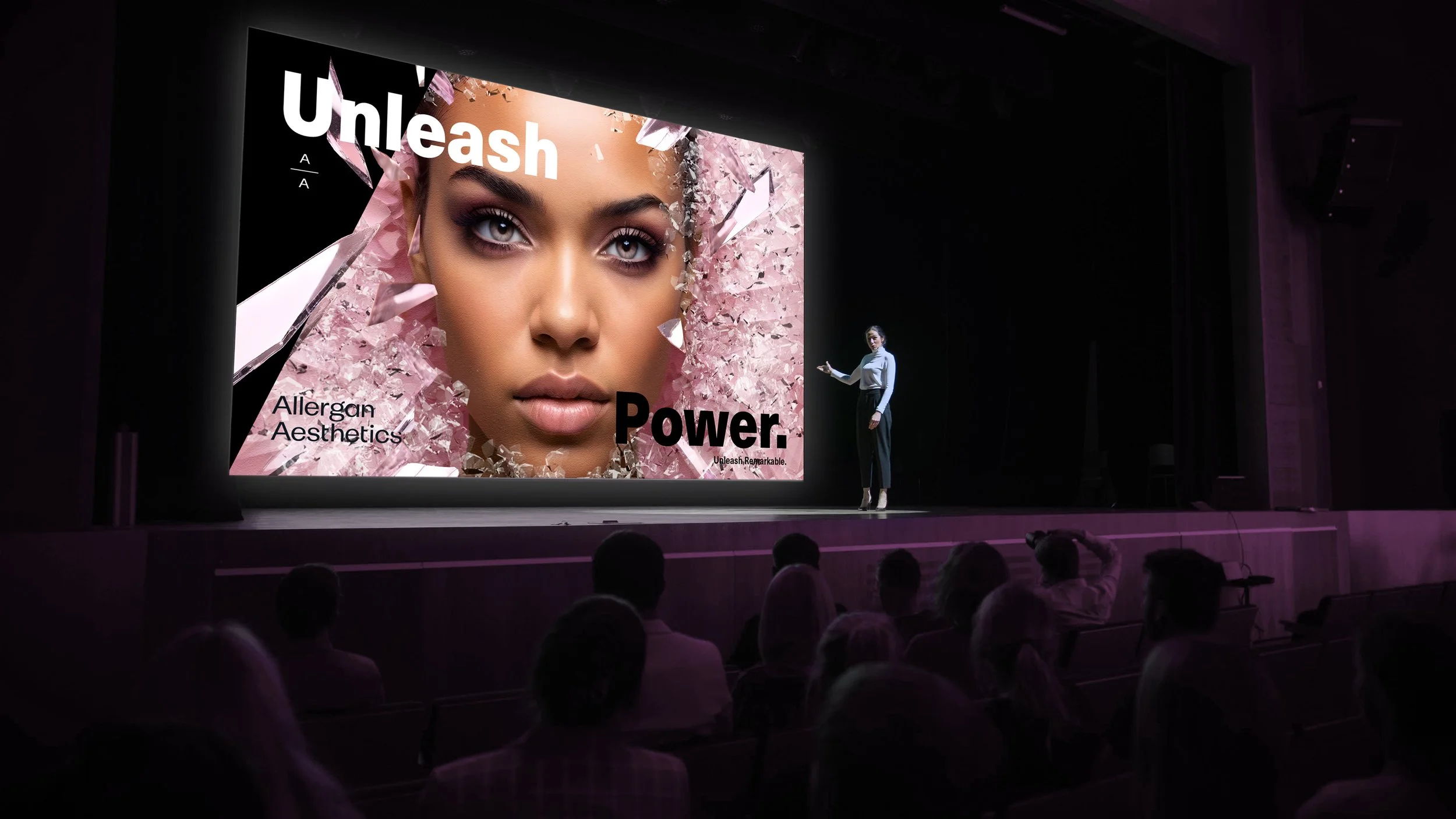 man-stands-stage-front-large-screen-that-says-natural-network.jpg