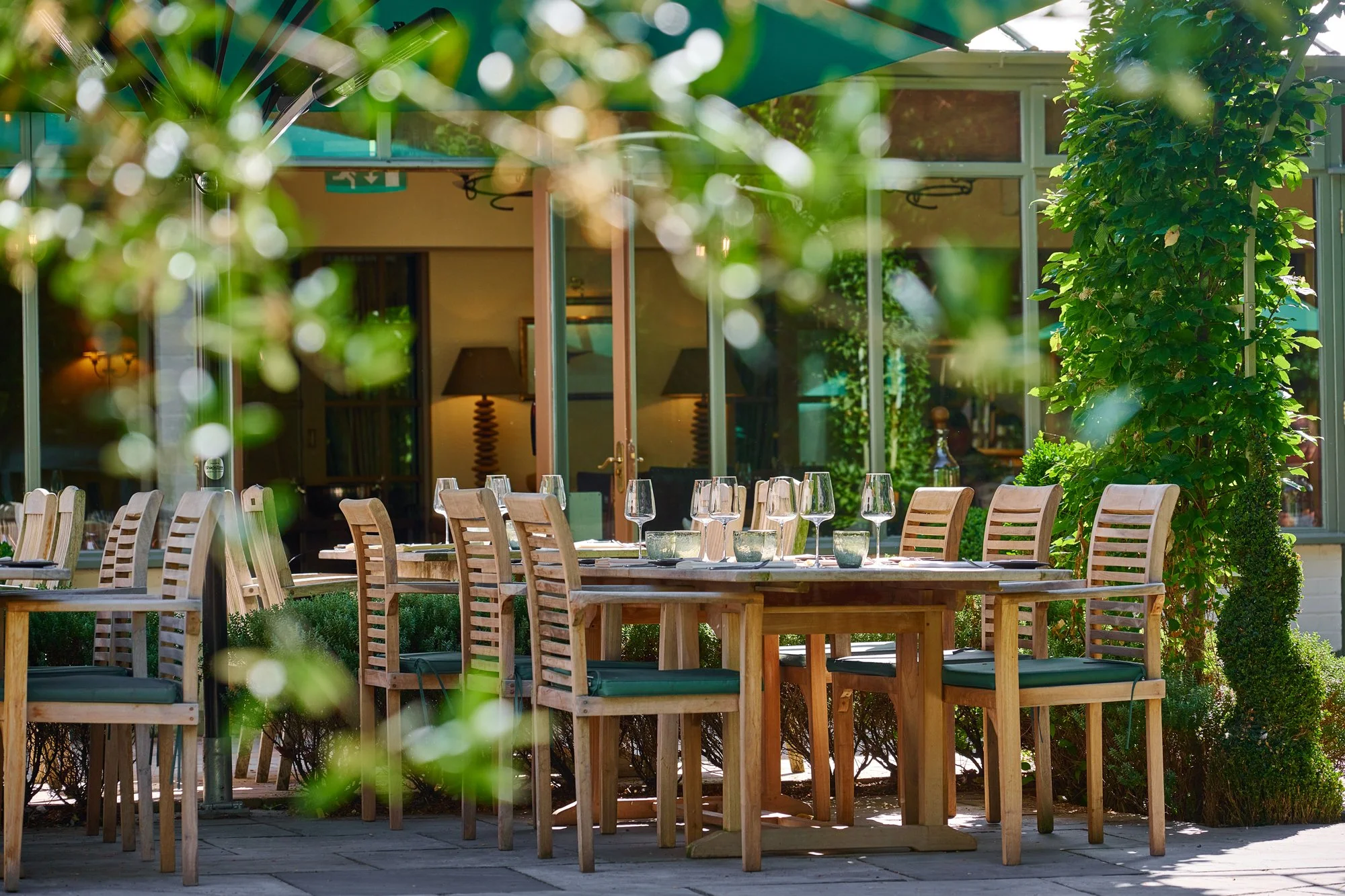 May-Tim-Green-patio-tables-in-sunshine-web.jpg