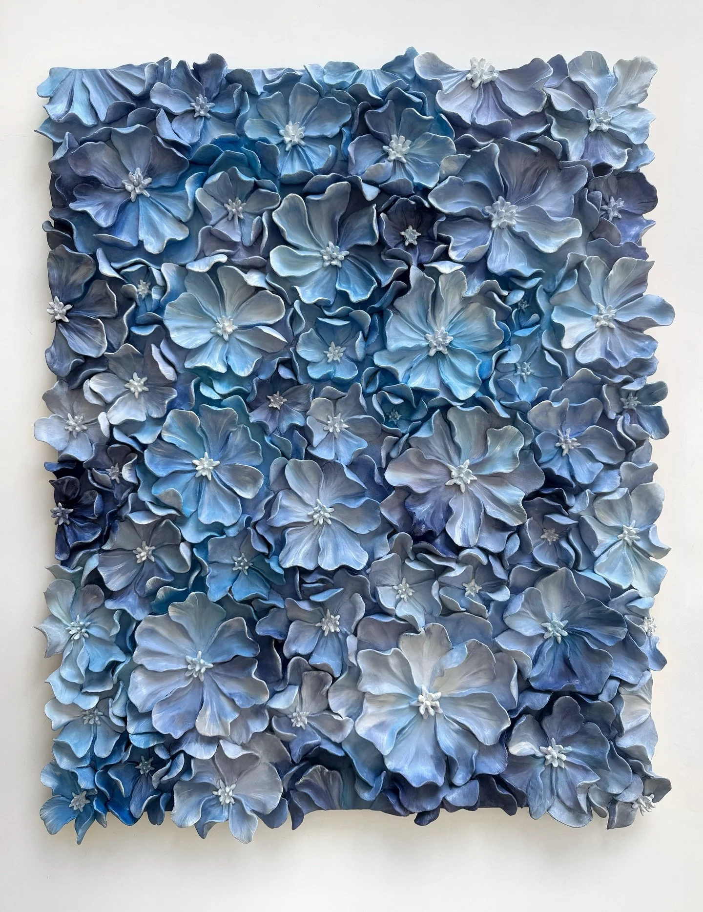 This is the largest piece I&rsquo;ve created so far, 25 &times; 31 inches (63.5 &times; 78.7 cm) 💙
Every single petal was sculpted by hand and painted in oil. Many quiet, meditative hours went into this work.

It slowly became a floral field that fe