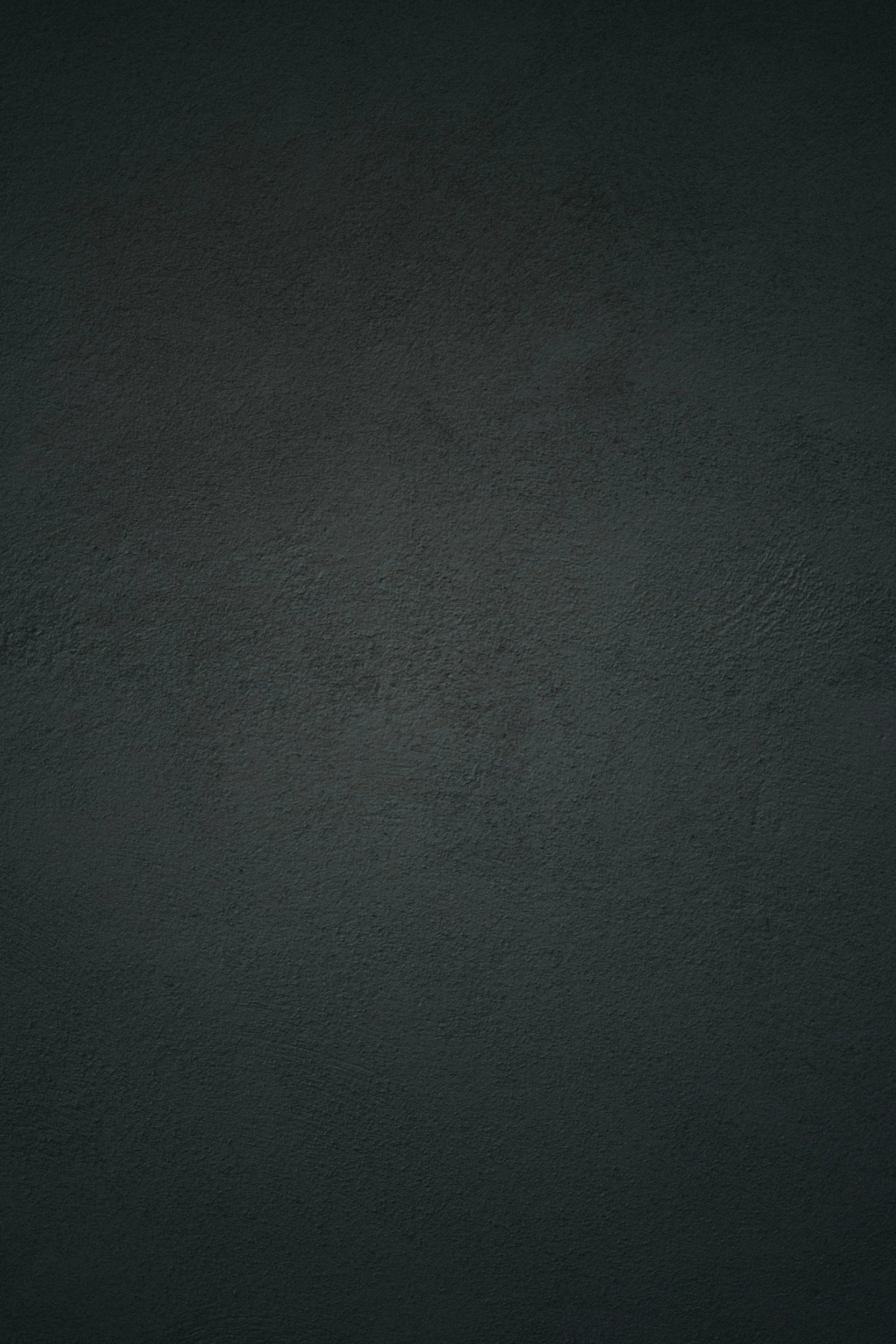 A textured, dark gray surface.