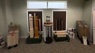 Display of various interior building supplies on stands in a showroom