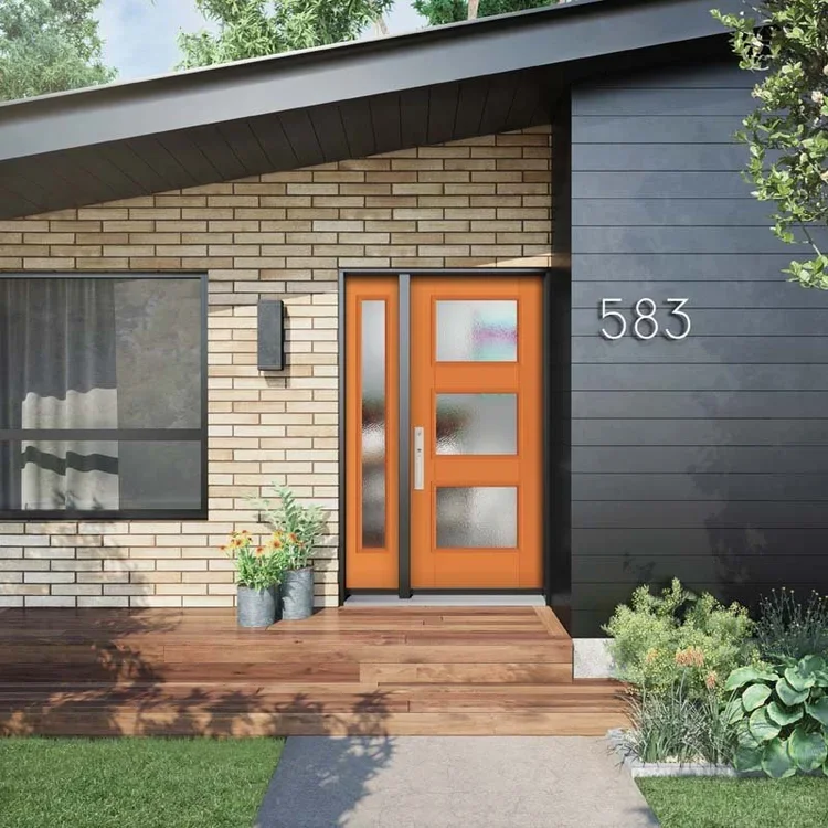 Modern house front door with an orange door, black siding, brick wall, and house number 583, with plants and a wooden porch
