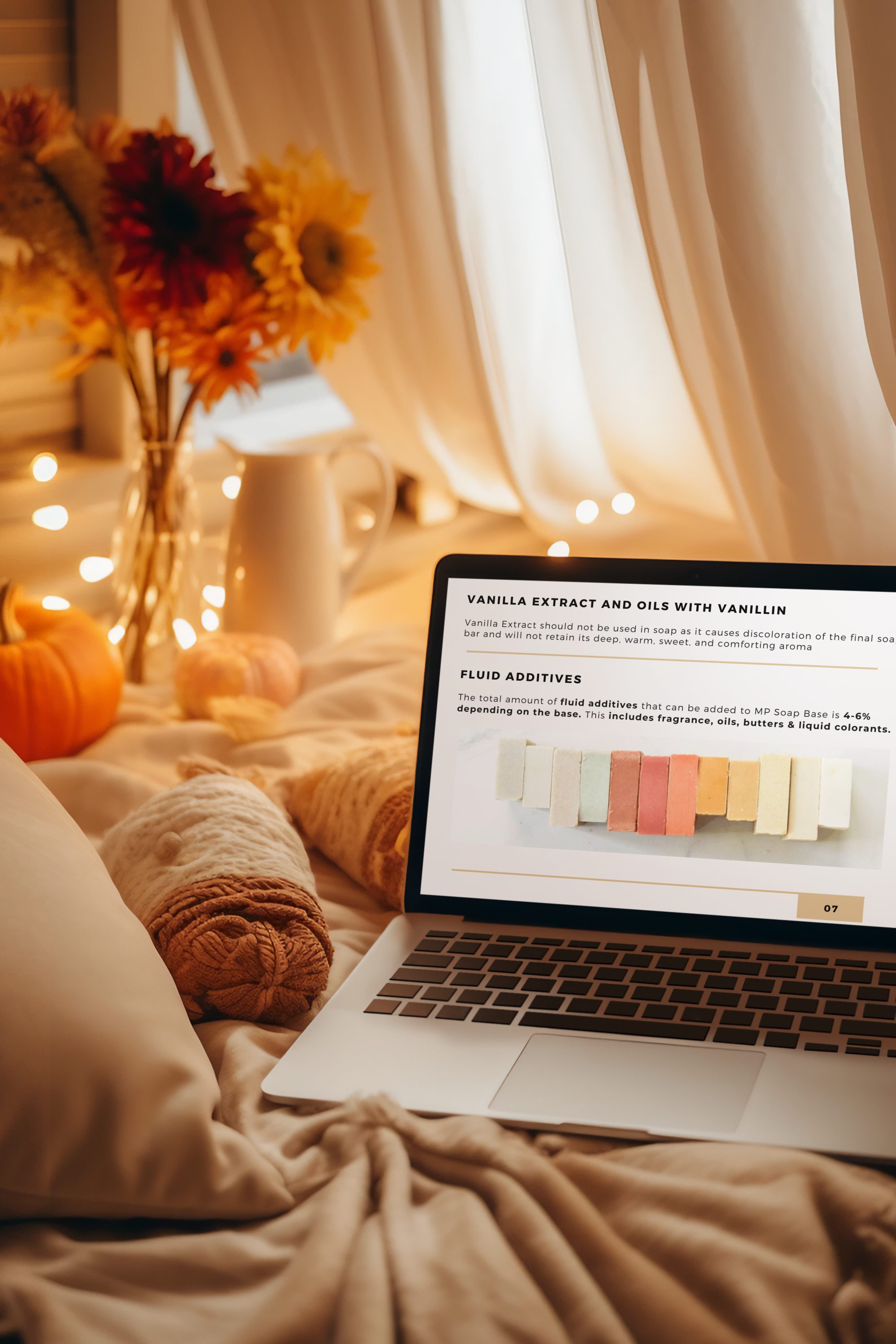 mockup-of-a-macbook-pro-placed-in-a-cozy-setting-decorated-with-flowers-and-candles-m36541.png