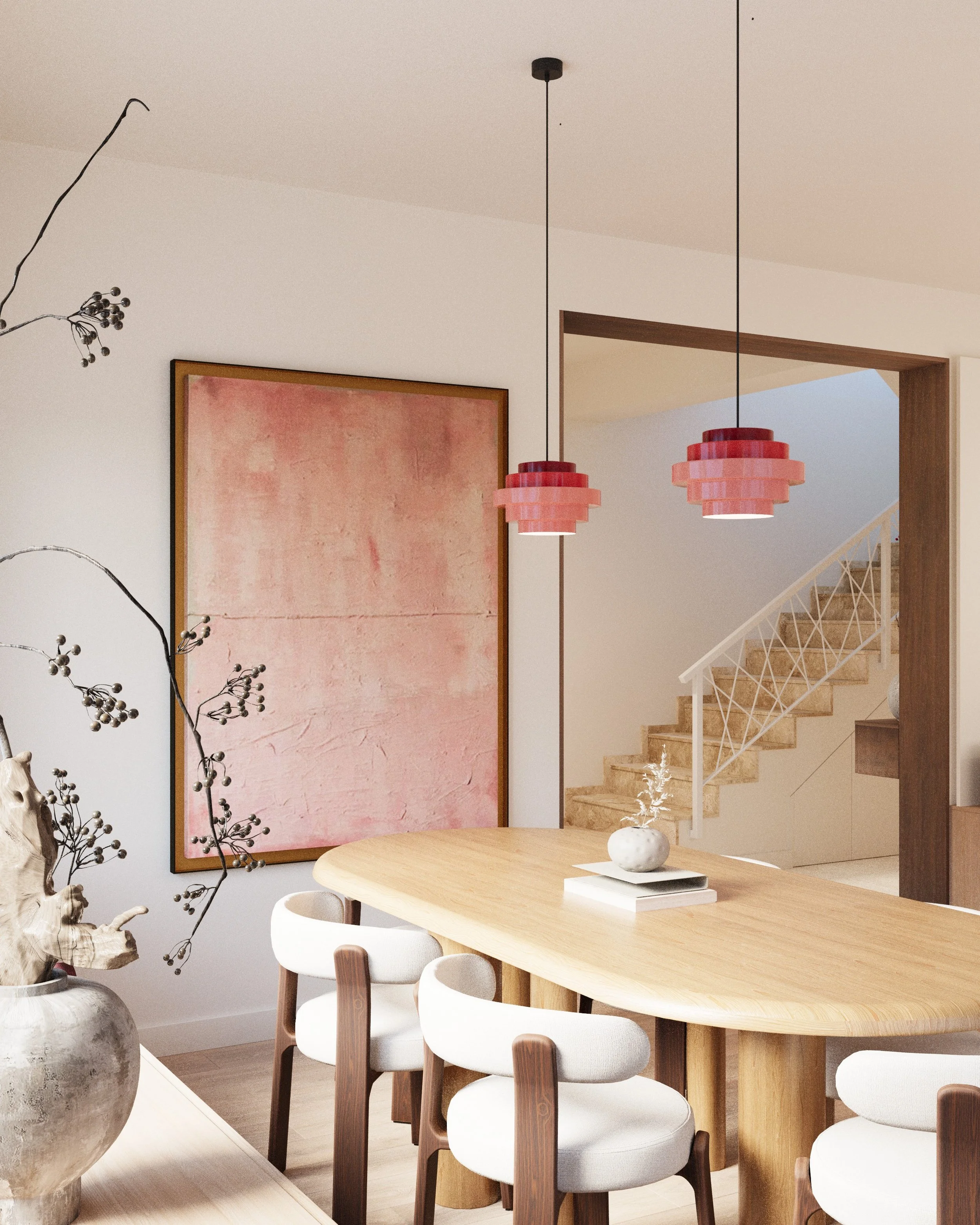 A modern dining area with a wooden table and white chairs, pendant lights, and a staircase in the background.