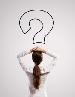 Professional Woman looking at Question Mark