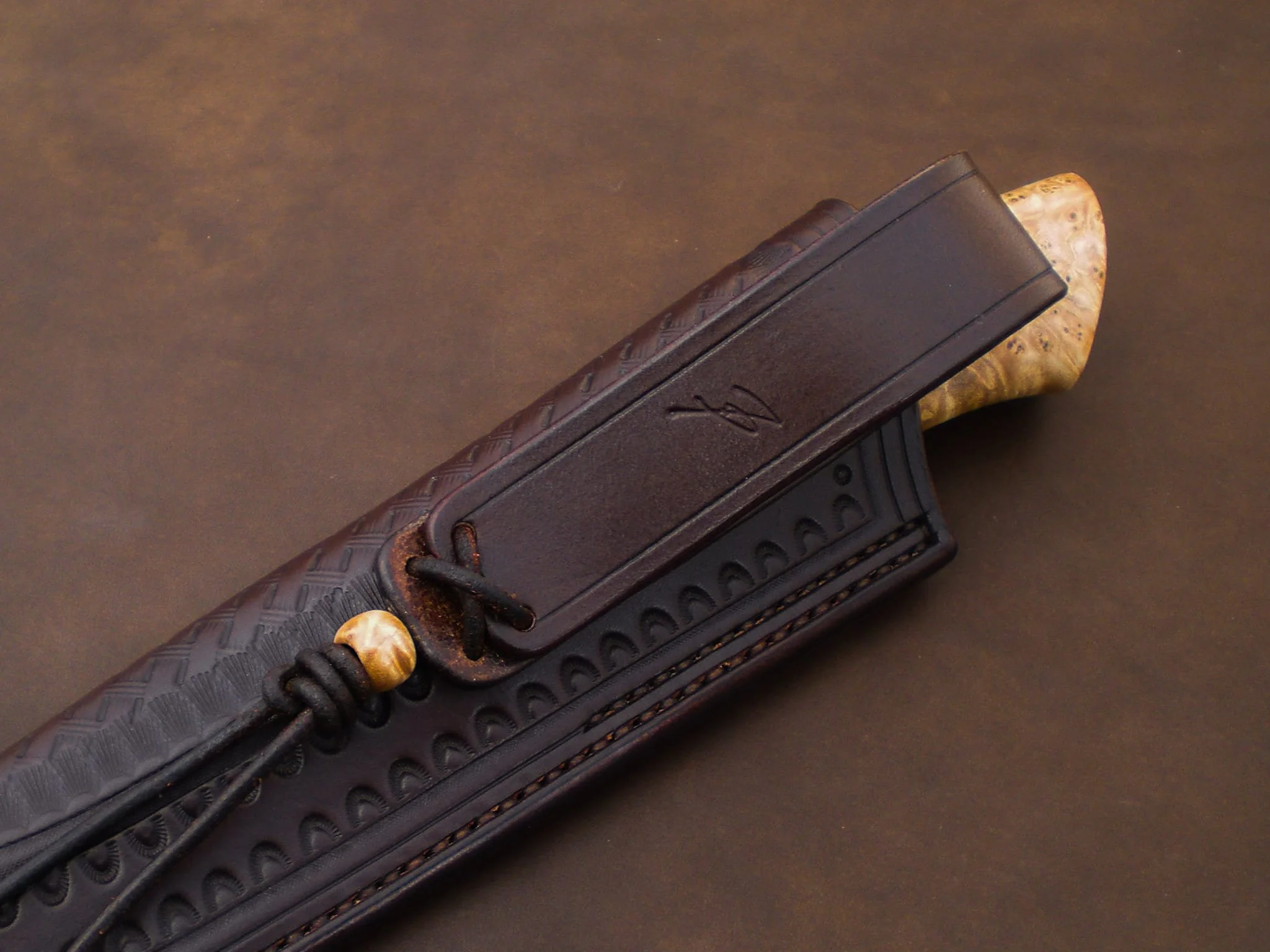 Close-up of a knife leather sheath.