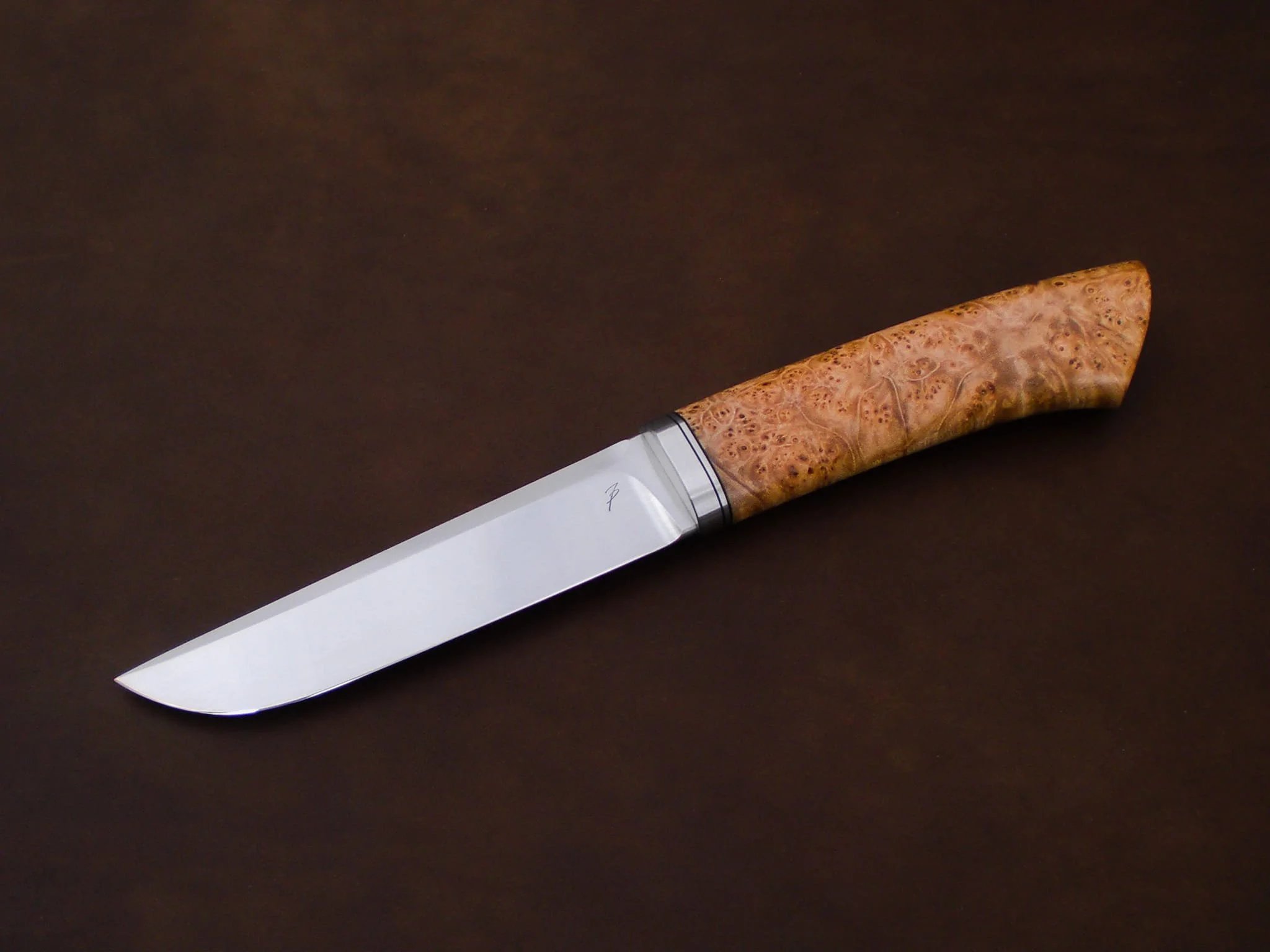 A northern knife with a wooden handle.