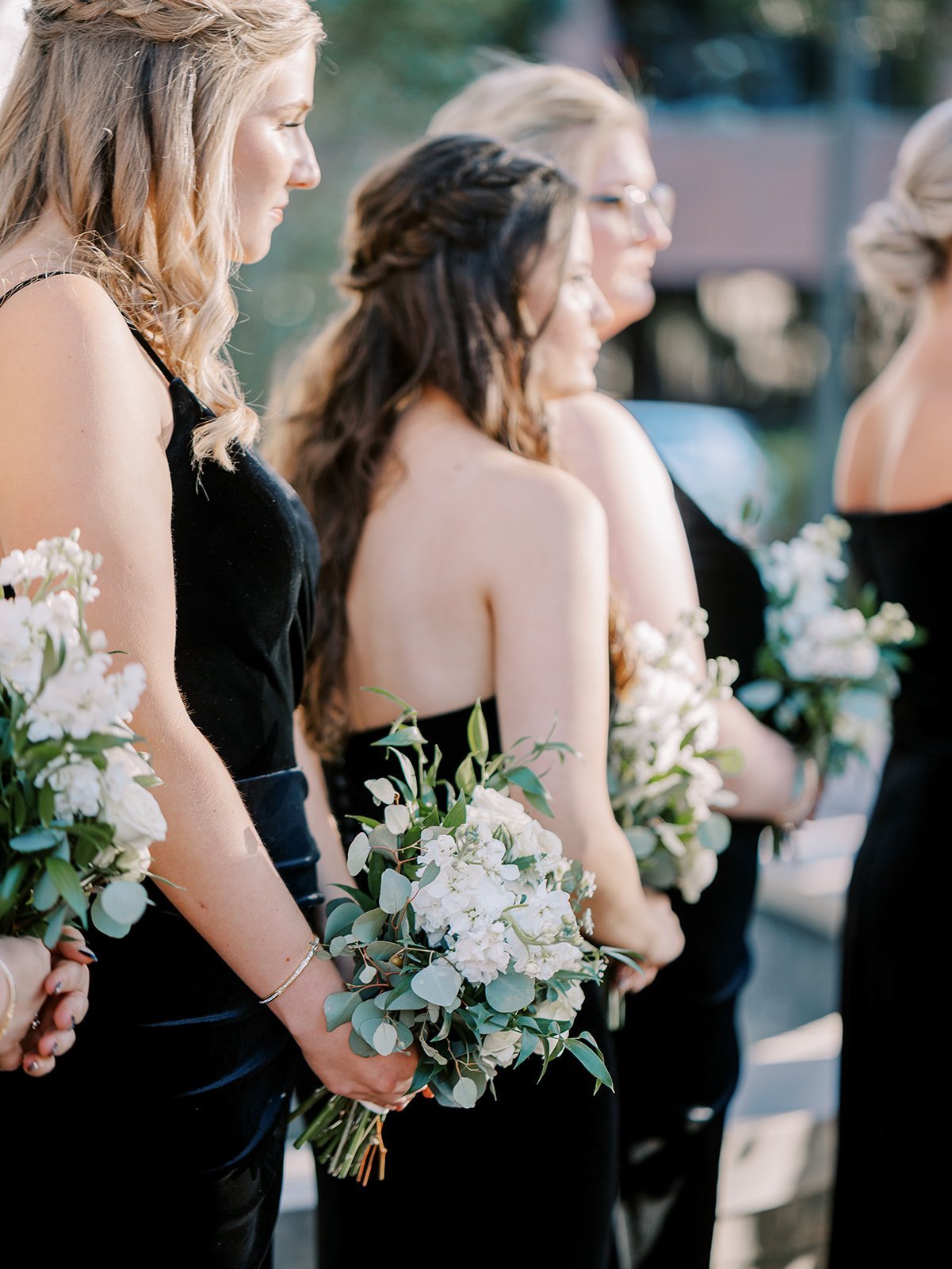 black bridesmaids dresses with ivory bridesmaids bouquet
