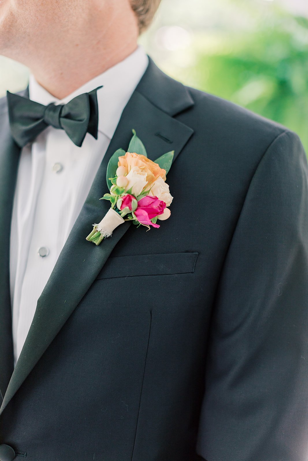 fun bright summery citrus and pink boutonniere