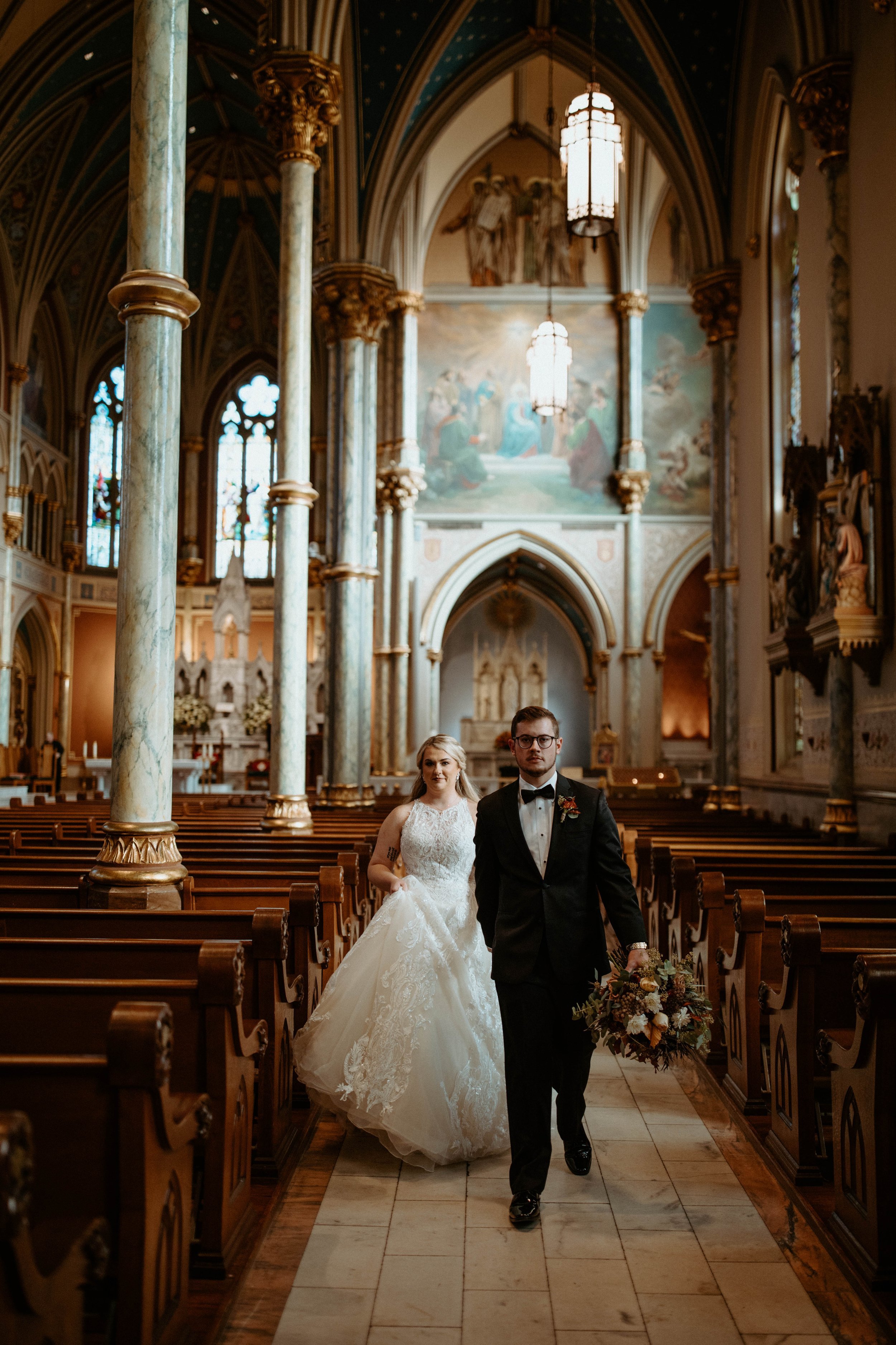 Ivory-and-beau-bride-ansley-bought-sparkly-and-traditional-highneck-ballgown-at-savannah-bridal-shop-gets-married-at-cathedral-with-the-help-of-ivory-and-beau-who-created-floral-peices-for-the-ceremony-and-reception-in-their-savannah-florwer-shop-1.jpg