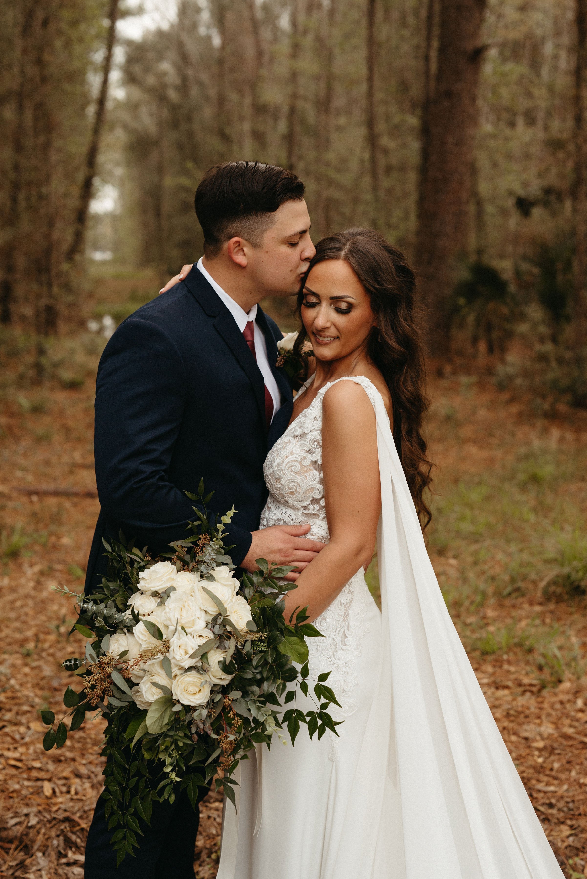 ivory-and-beau-blog-down-for-the-gown-lorren-real-bride-southern-bride-maggie-sottero-wedding-dress-made-with-love-bridal-wings-savannah-bridal-shop-savannah-bridal-boutique-savannah-georgia-The_Buie_Barn_Hall_Wedding_March_2022-45.jpg