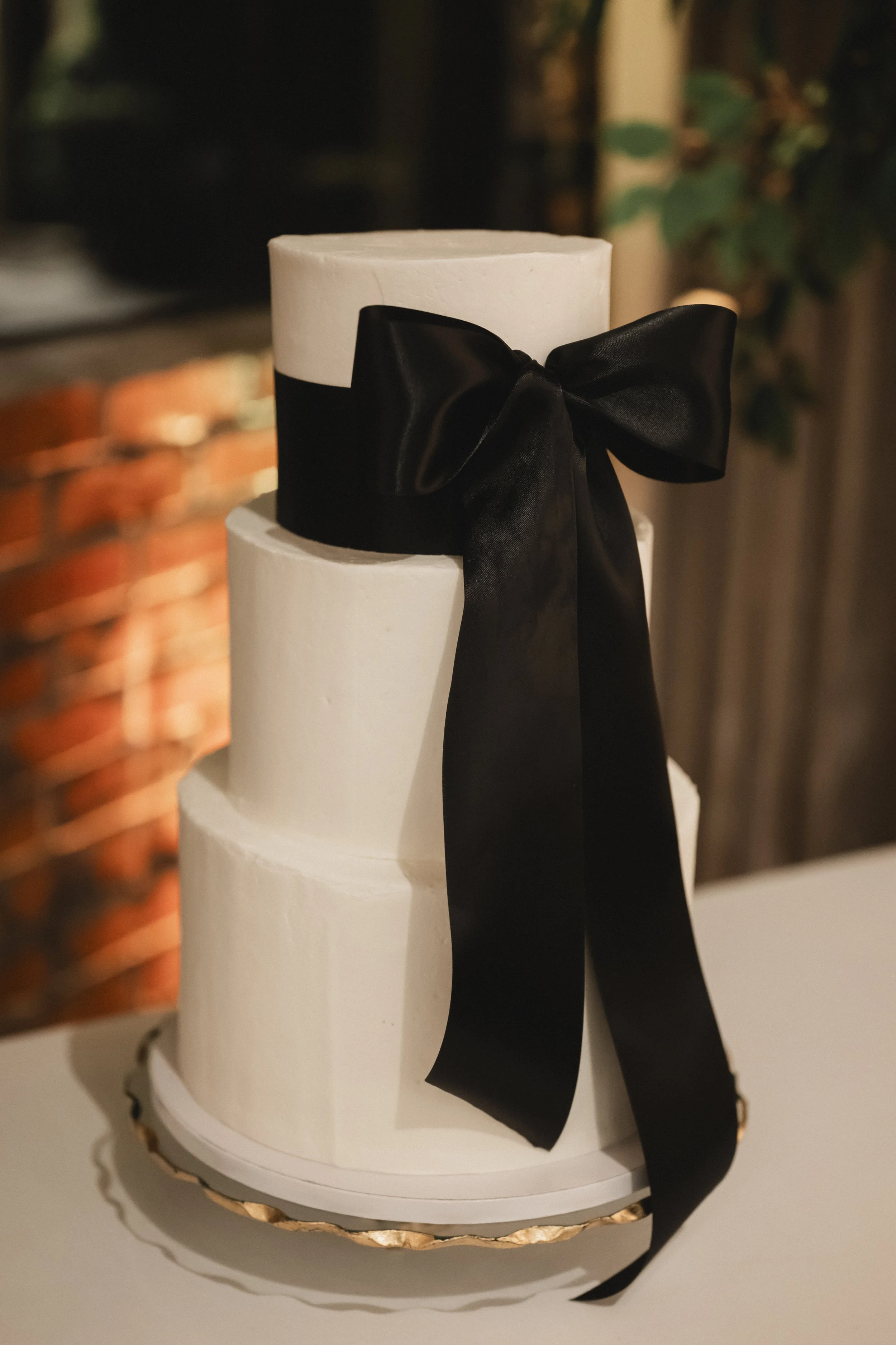 Modern White Wedding Cake with Black Bow