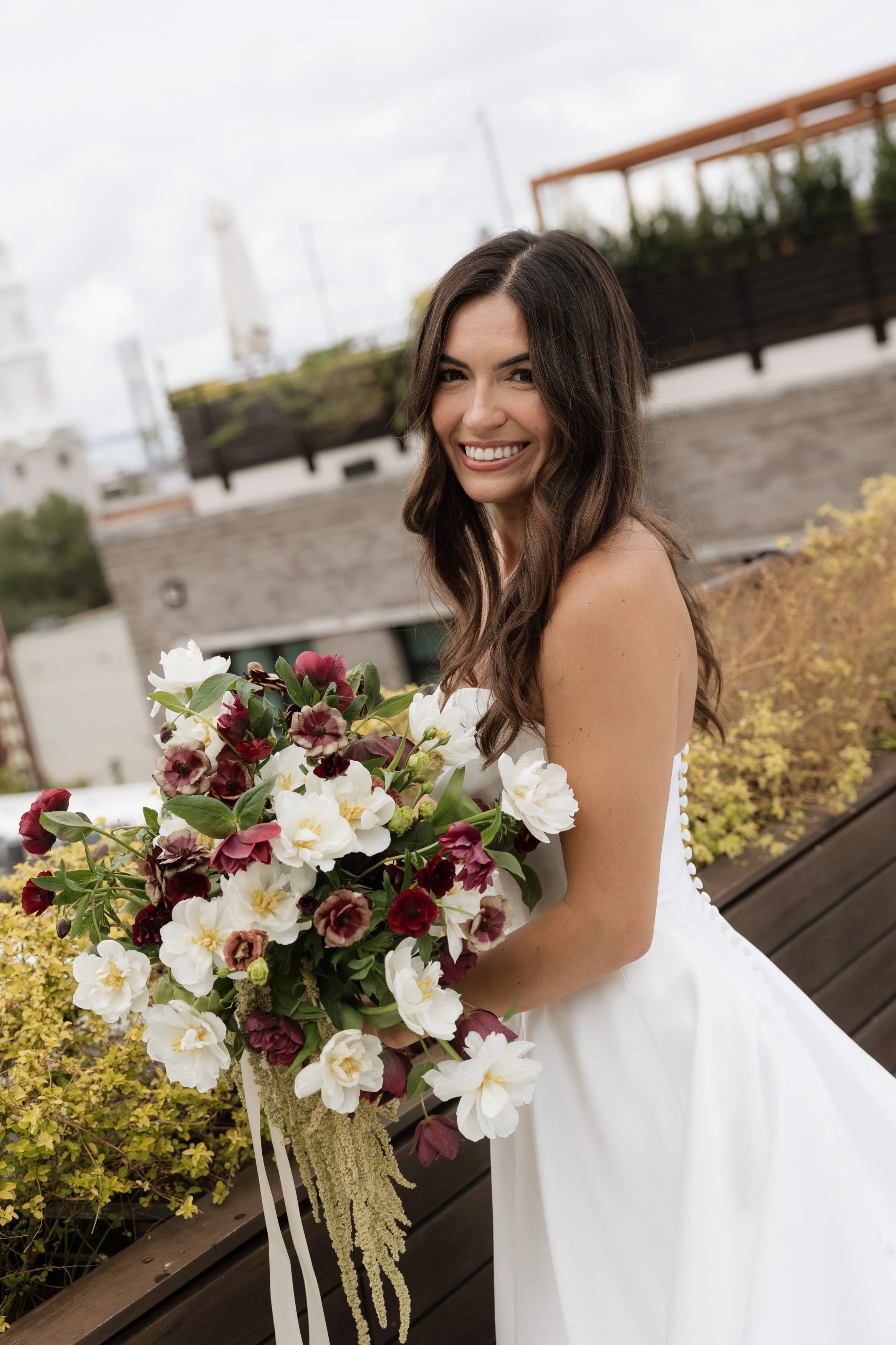 Bride with bouquet – rooftop