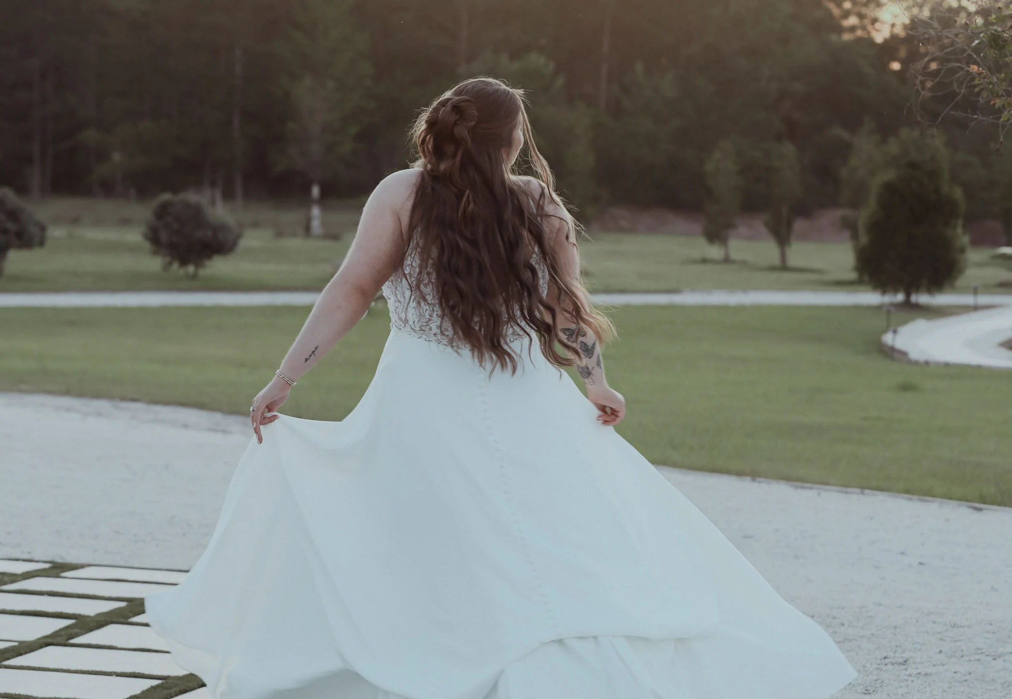 bride-twirling-in-a-line-classic-southern-wedding-dress-ivory-and-beau-savannah-wedding-dresses-southern-bridal-shop-affordable-wedding-dresses.jpeg