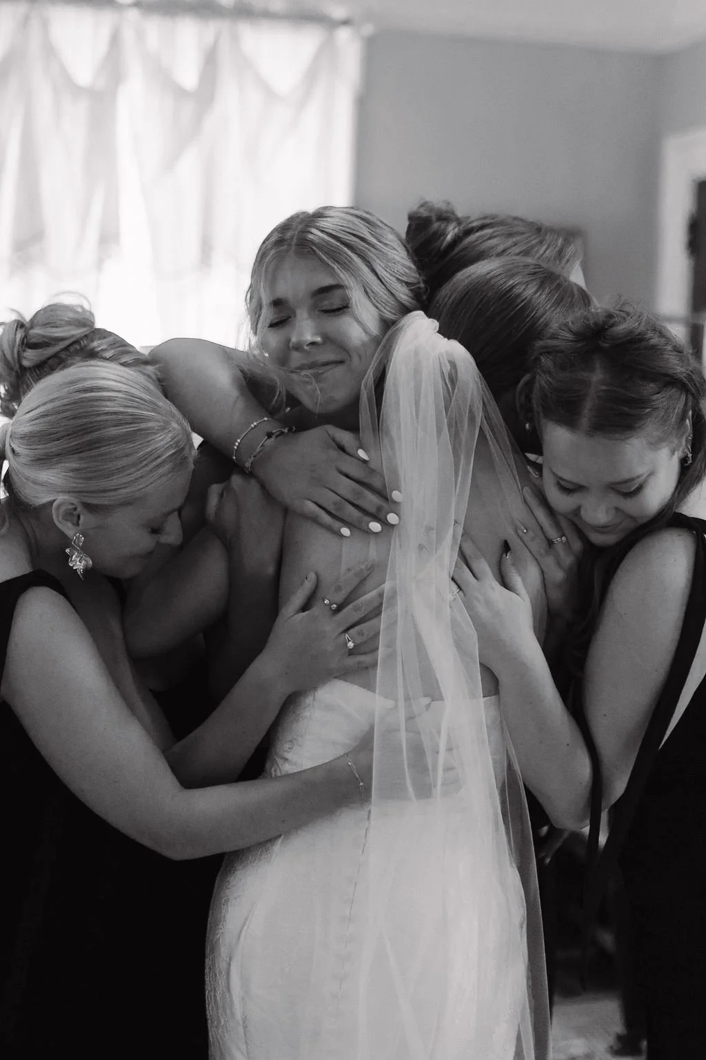 noor-by-locket-sweet-moment-with-bridesmaids-before-wedding-savannah-bride-southern-wedding-dresses-ivory-and-beau-savannah-wedding-shop-southern-bride.jpg