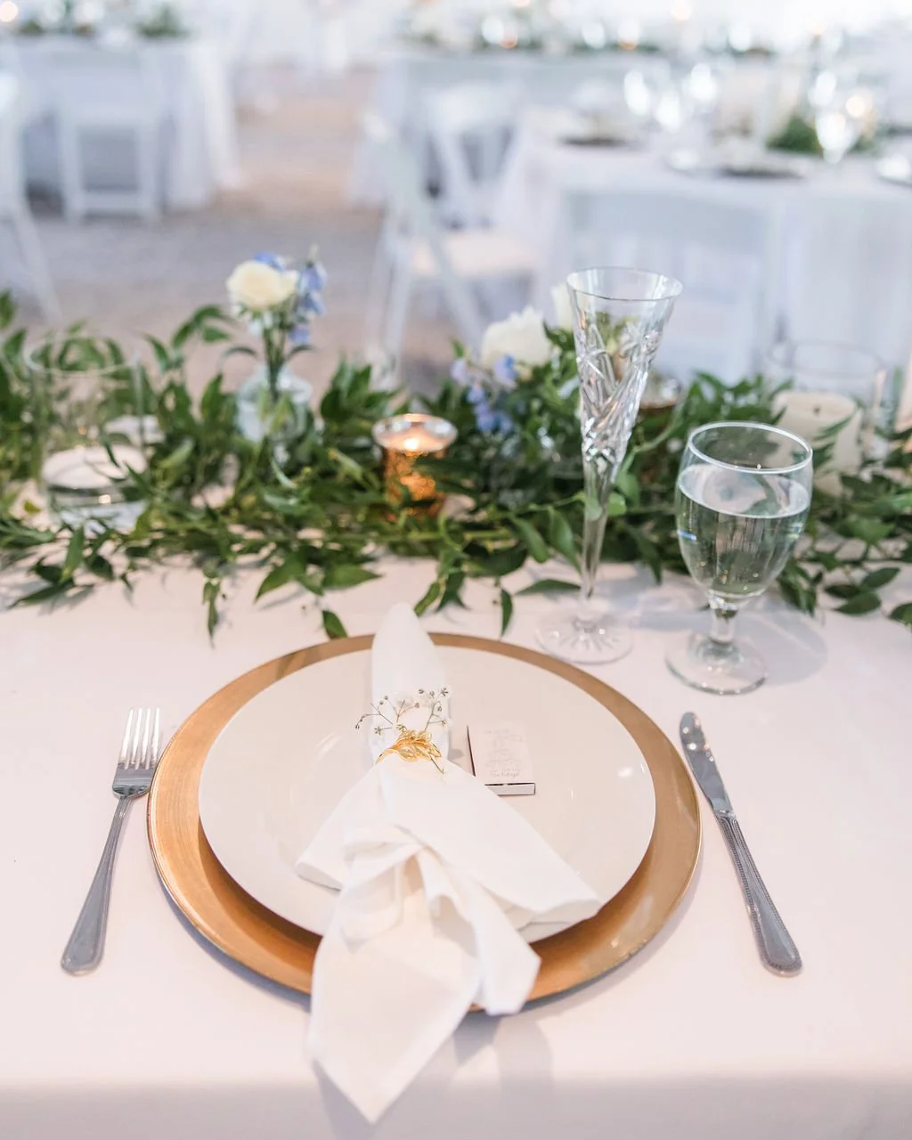 blue and white and greenery centerpieces at the mackey house in savannah georgia.jpg