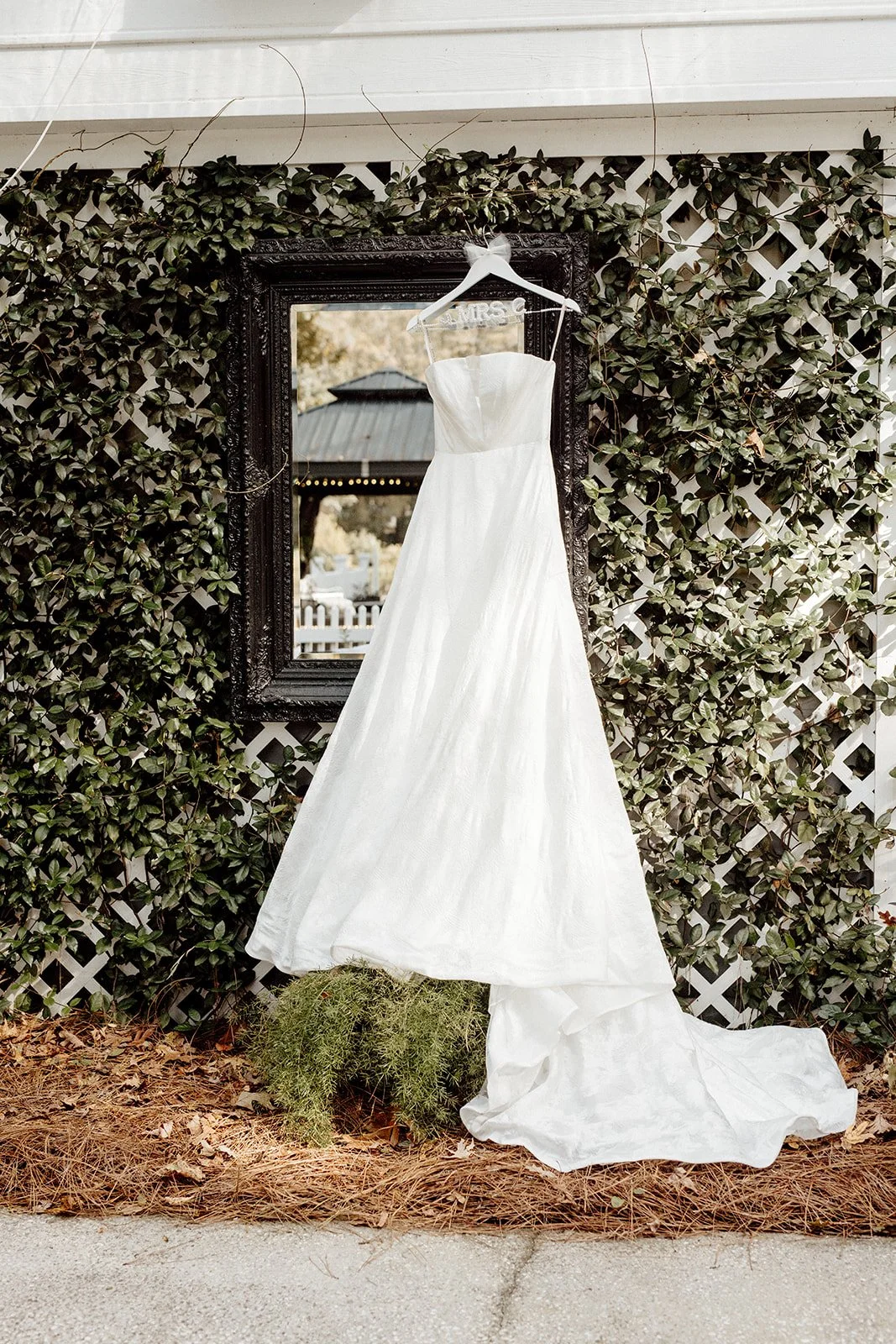 ivory-and-beau-savannah-georgia-wedding-dresses-southern-weddings-mackey-house-pink-florals-luxury-wedding-florals-reception-tablescape-red-pink-winter-wedding-christmas-dress-photos-handing-wedding-gown.jpg