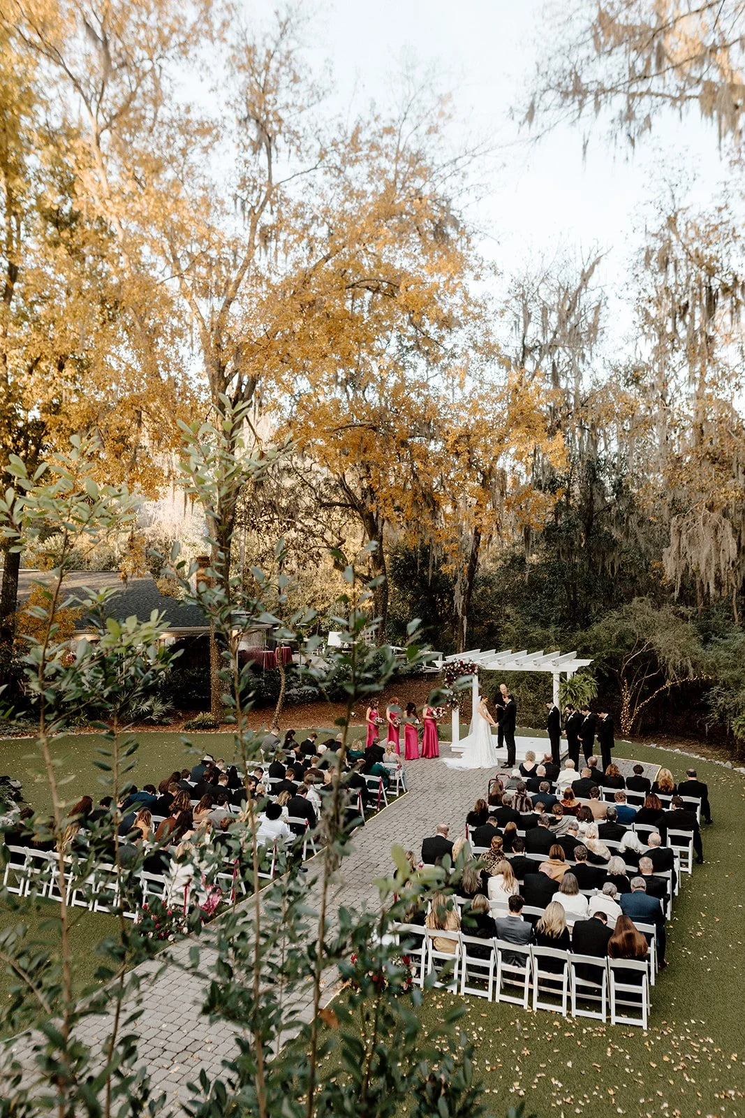 ivory-and-beau-savannah-georgia-wedding-dresses-southern-weddings-mackey-house-pink-florals-luxury-wedding-florals-reception-tablescape-red-pink-winter-wedding-christmas-ceremony-shot.jpg