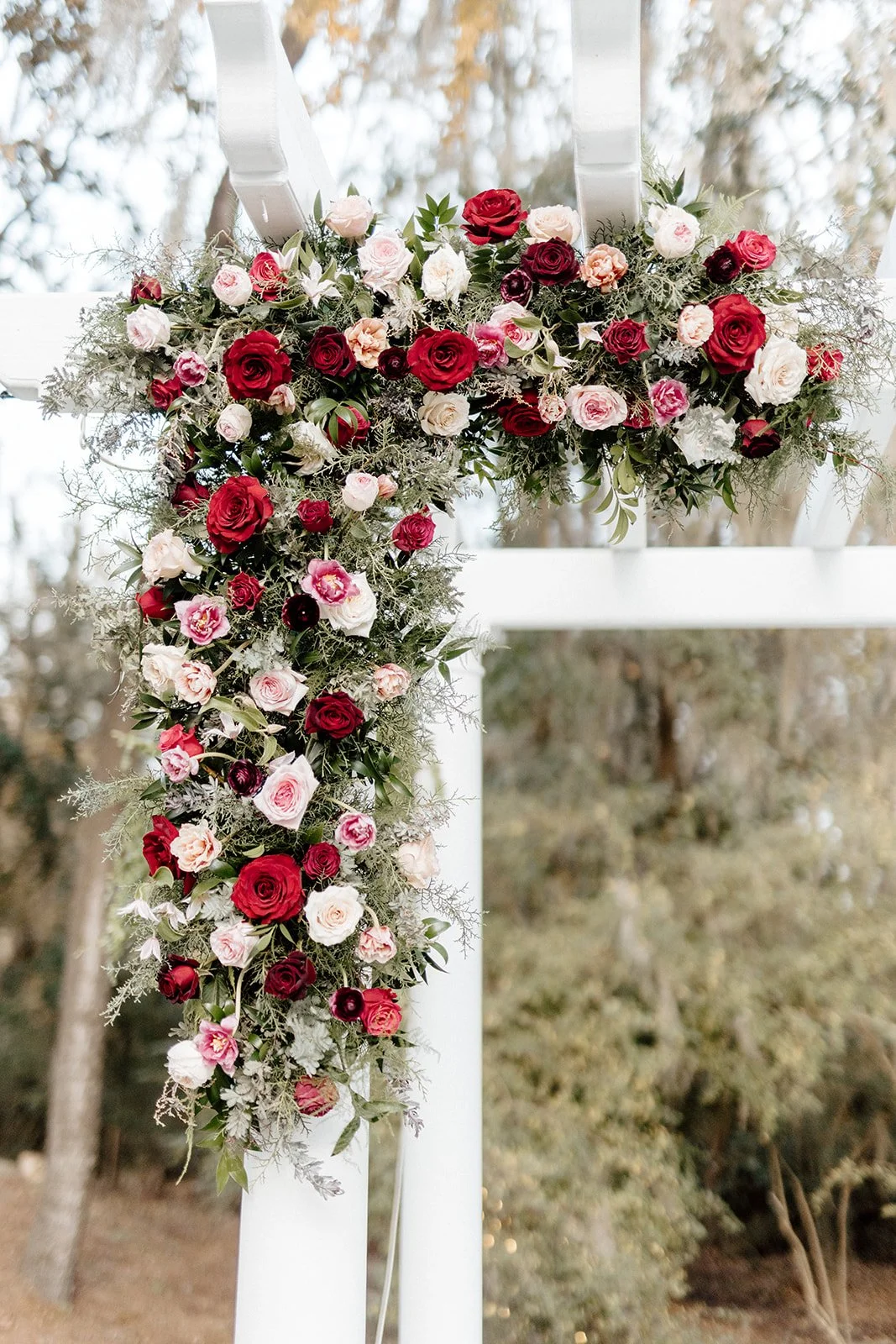 ivory-and-beau-savannah-georgia-wedding-dresses-southern-weddings-mackey-house-pink-florals-luxury-wedding-florals-reception-tablescape-red-pink-winter-wedding-christmas-installation-ceremony-arch.jpg