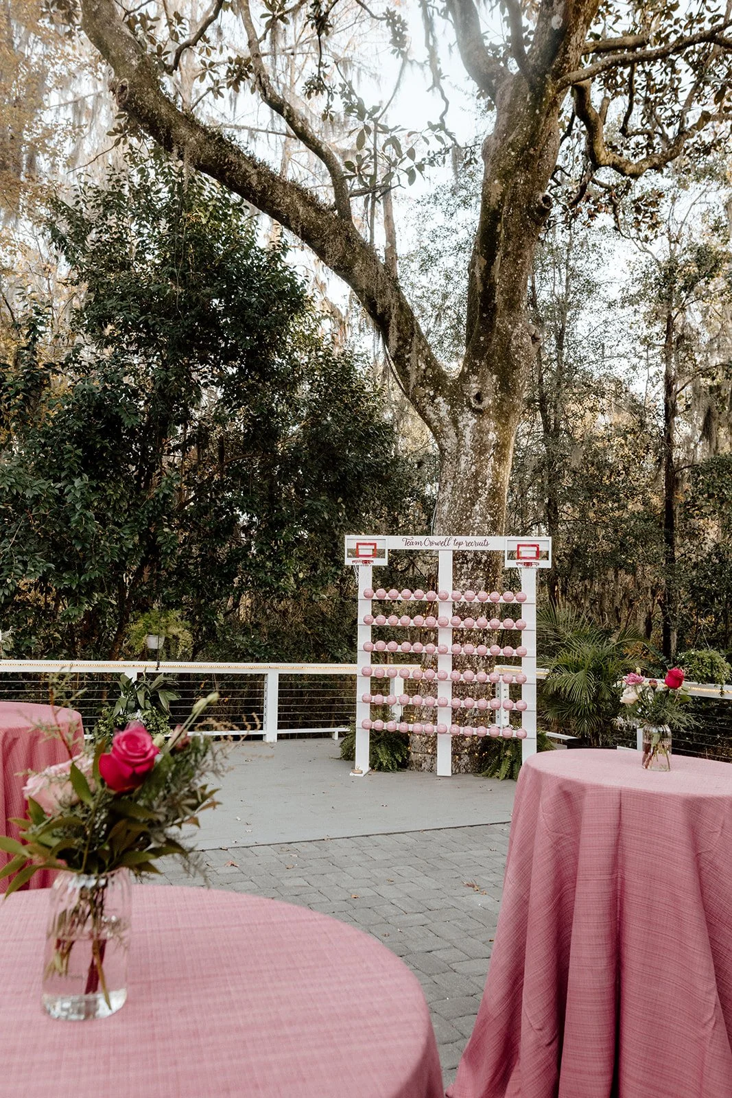 ivory-and-beau-savannah-georgia-wedding-dresses-southern-weddings-mackey-house-pink-florals-luxury-wedding-florals-reception-tablescape-red-pink-winter-wedding-christmas-cock-tsil-hour-basketball-seating-chart.jpg