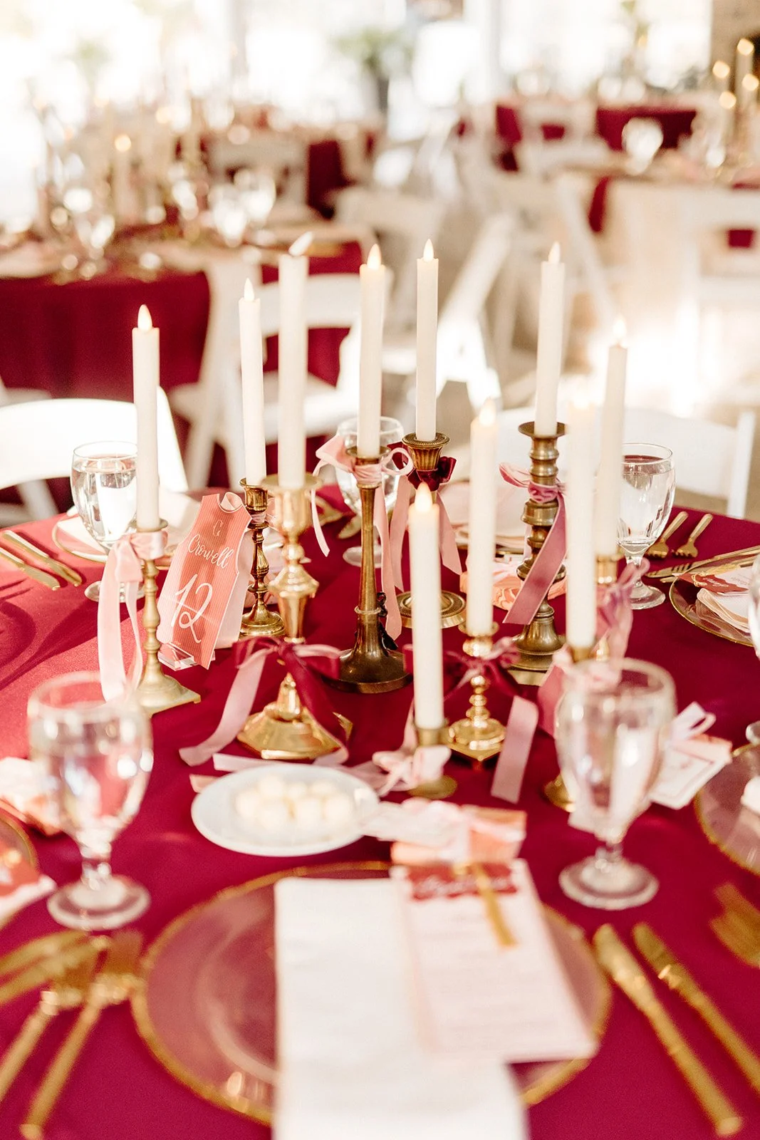 ivory-and-beau-savannah-georgia-wedding-dresses-southern-weddings-mackey-house-pink-florals-luxury-wedding-florals-reception-tablescape-red-pink-winter-wedding-christmas-table-numbers.jpg