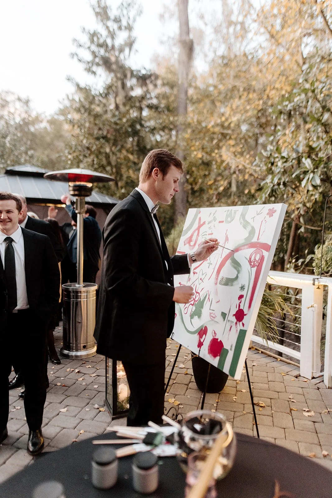 ivory-and-beau-savannah-georgia-wedding-dresses-southern-weddings-mackey-house-pink-florals-luxury-wedding-florals-reception-tablescape-red-pink-winter-wedding-christmas-guest-book-painting-welcome.jpg