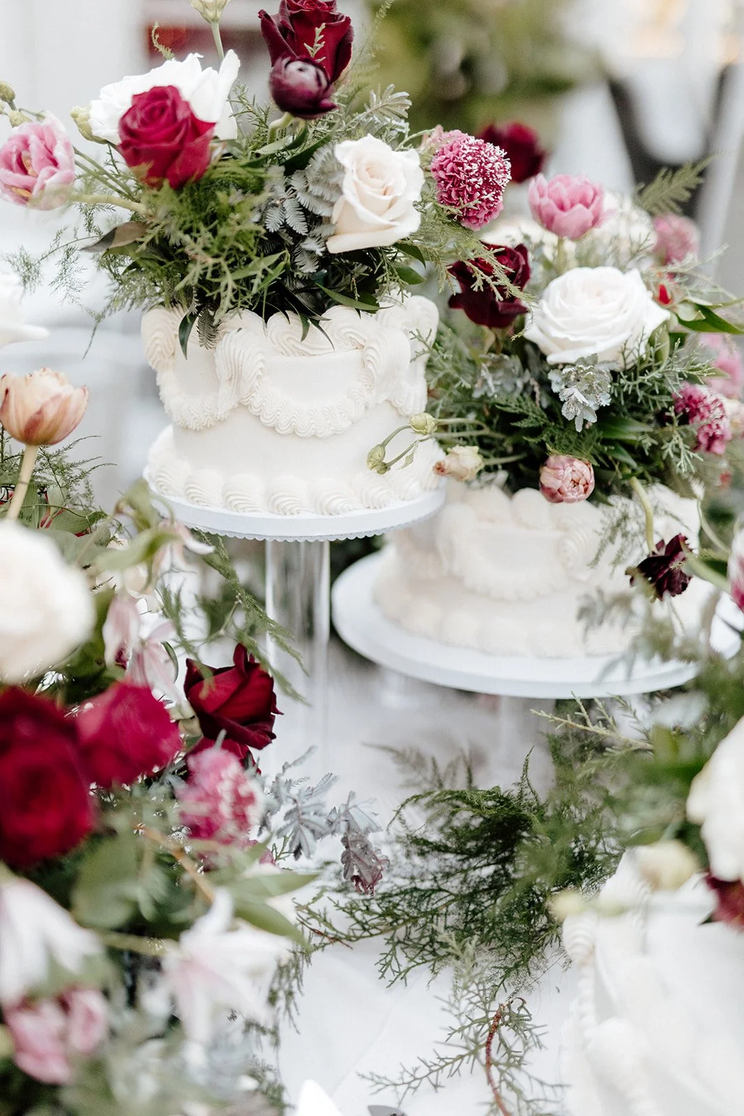 ivory-and-beau-savannah-georgia-wedding-dresses-southern-weddings-mackey-house-pink-florals-luxury-wedding-florals-reception-tablescape-red-pink-winter-wedding-christmas-cake-table-close-up.jpg