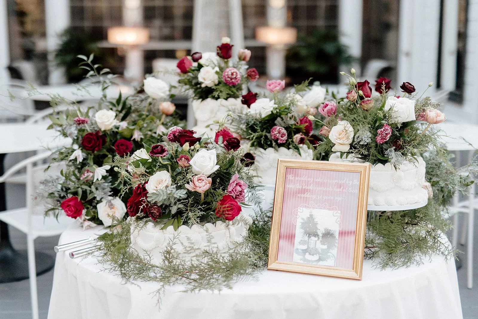 ivory-and-beau-savannah-georgia-wedding-dresses-southern-weddings-mackey-house-pink-florals-luxury-wedding-florals-reception-tablescape-red-pink-winter-wedding-christmas-cake-table.jpg