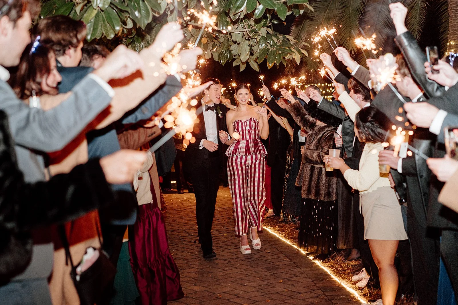 ivory-and-beau-savannah-georgia-wedding-dresses-southern-weddings-mackey-house-pink-florals-luxury-wedding-florals-pink-wedding-send-off-sparkler-exit.jpg