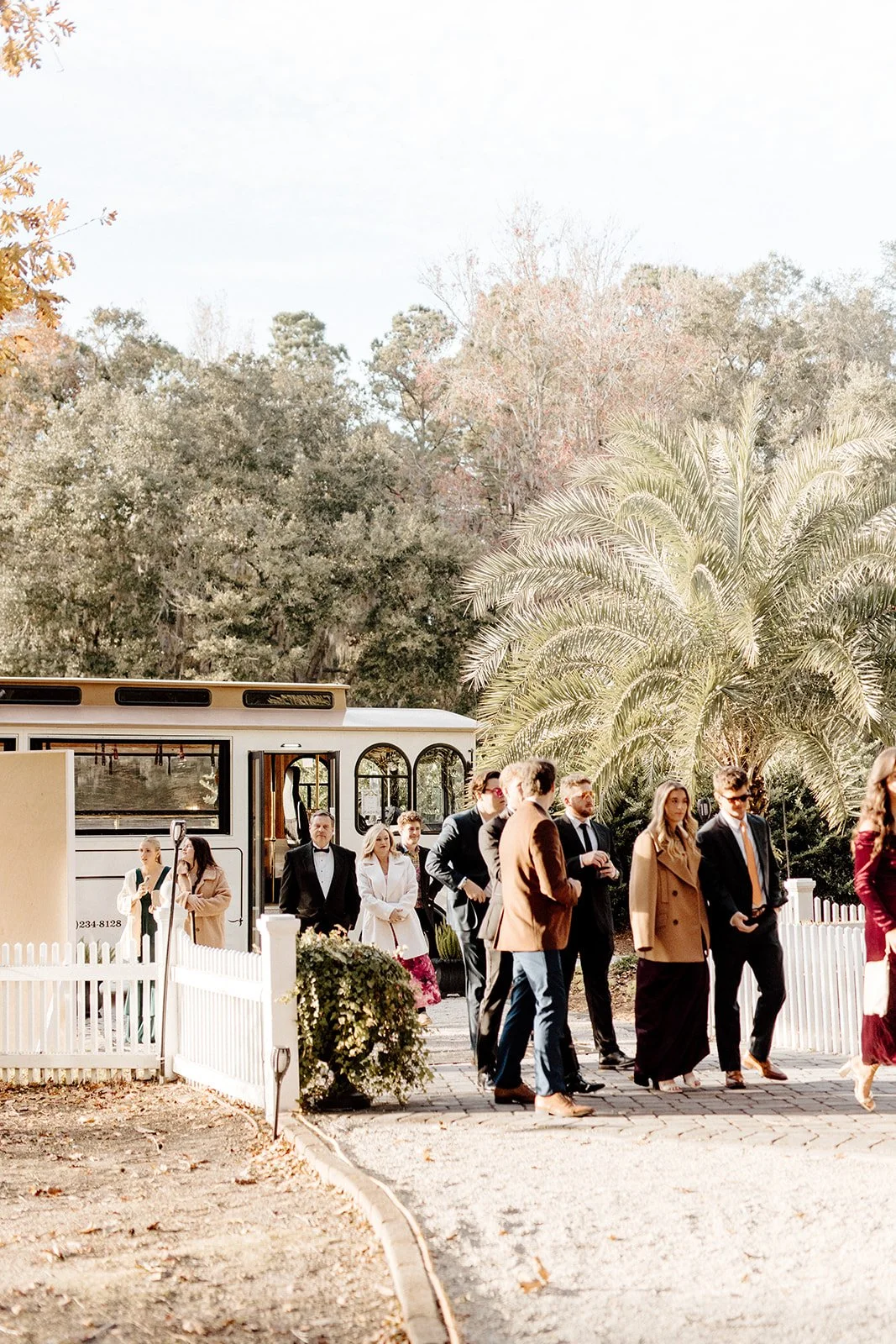 ivory-and-beau-savannah-georgia-wedding-dresses-southern-weddings-mackey-house-pink-florals-luxury-wedding-florals-reception-tablescape-red-pink-winter-wedding-christmas-guest-transportation-trolley.jpg