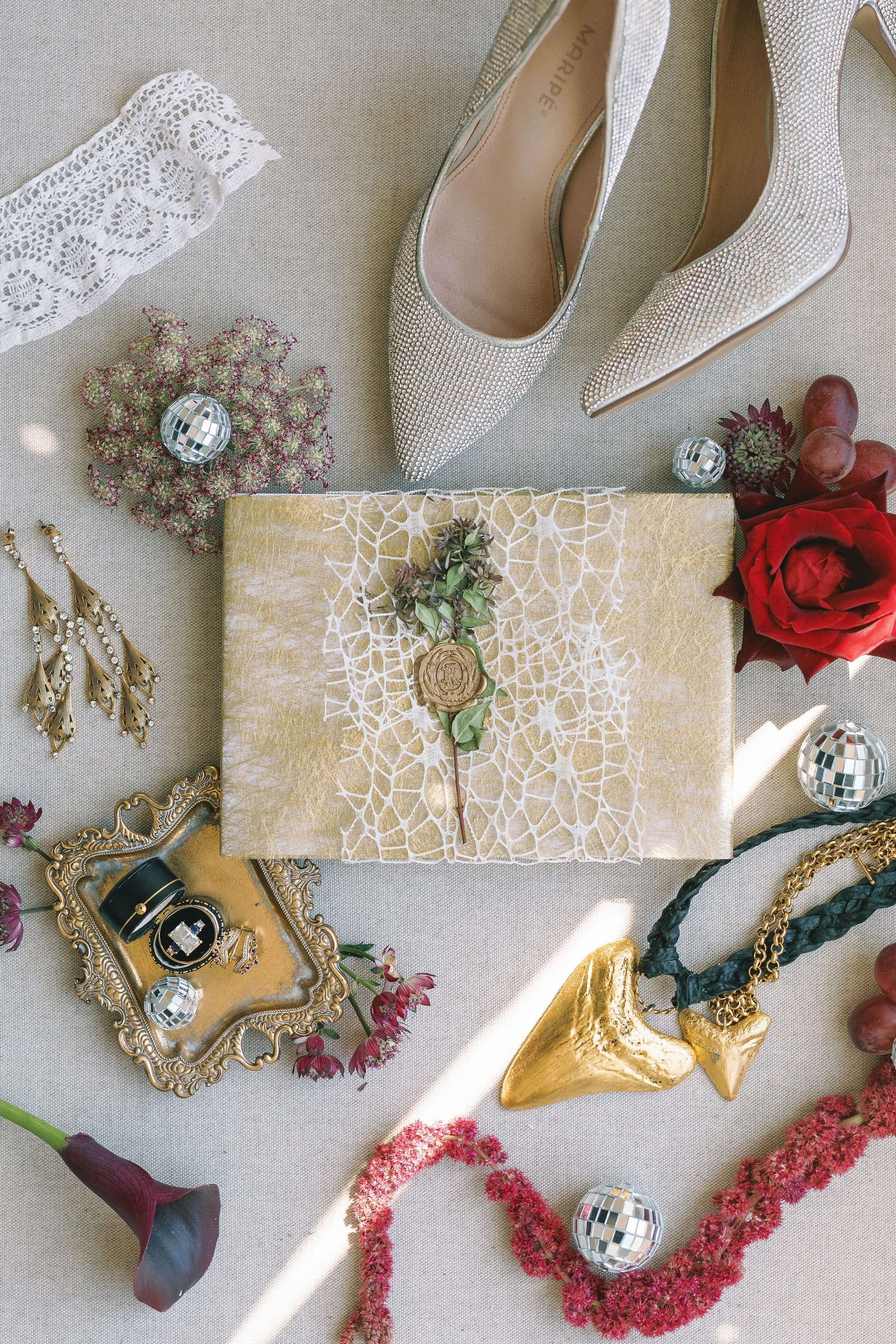 ivory-and-beau-weddings-rebecca-and-kevin-ships-of-the-sea-museum-wedding-venue-savannah-georgia-savannah-wedding-flowers-wedding-florist-flat-lay-rings.jpg