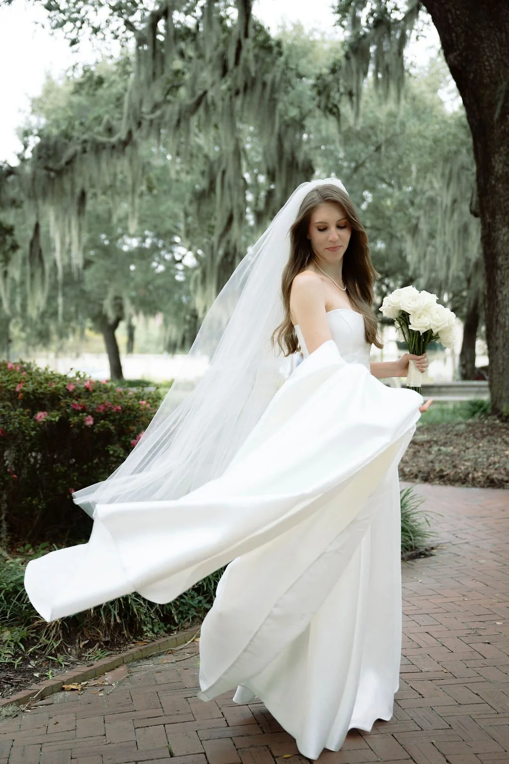 beautiful bride with flowing veil at the perry lane hotel.jpg