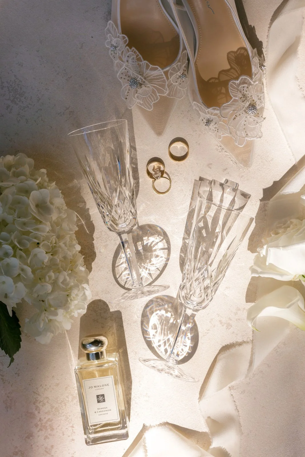 romantic-wedding-details-crystal-champagne-glasses-bridal-shoes.jpg