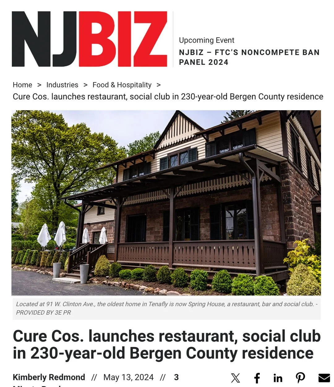 Front view of a historic house with a large porch, surrounded by green trees and shrubs, now used as a restaurant and social club, located at 91 W. Clinton Ave in Tenafly.