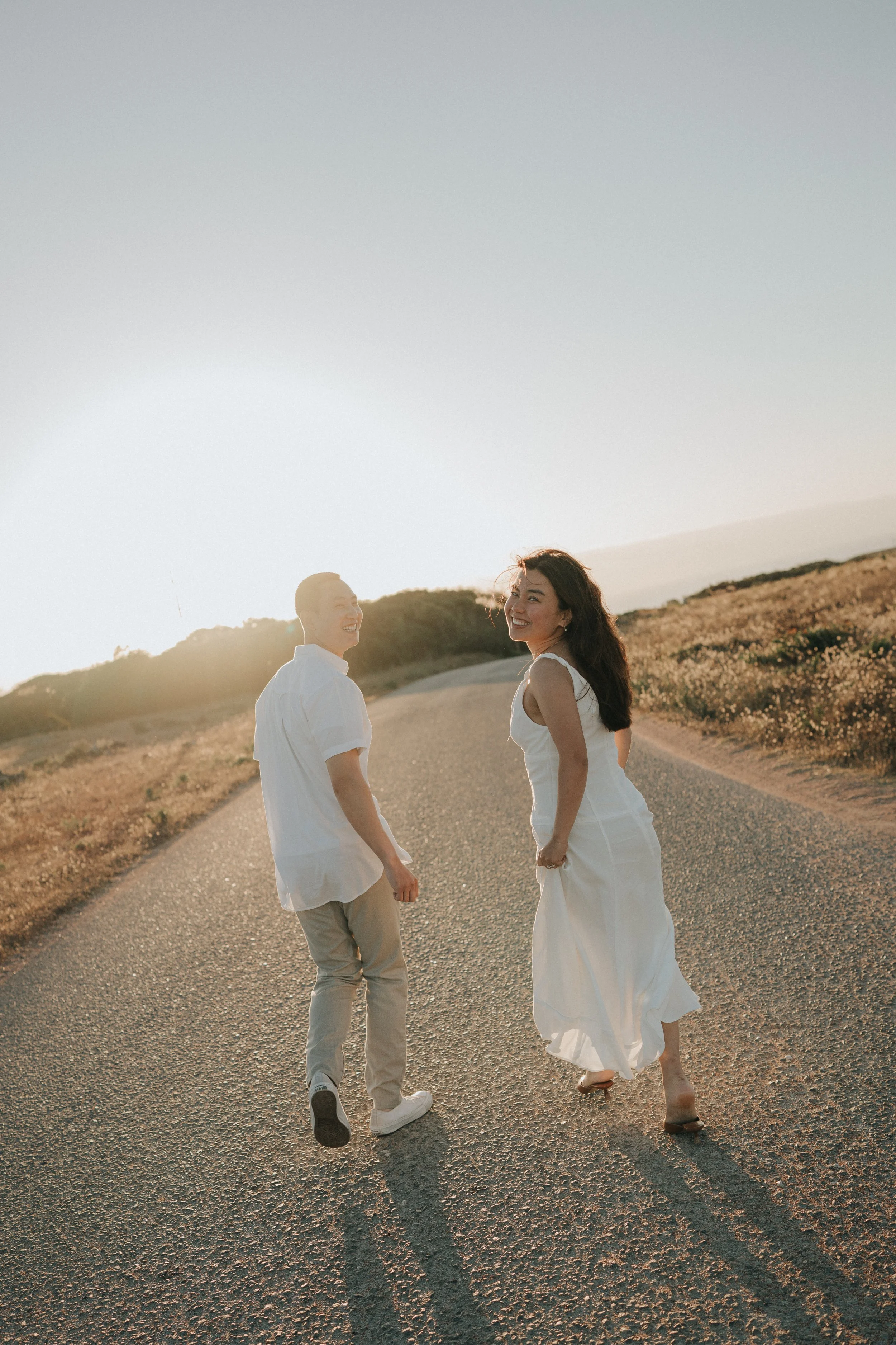 couple running at sunset at a Mallorca viewpoint