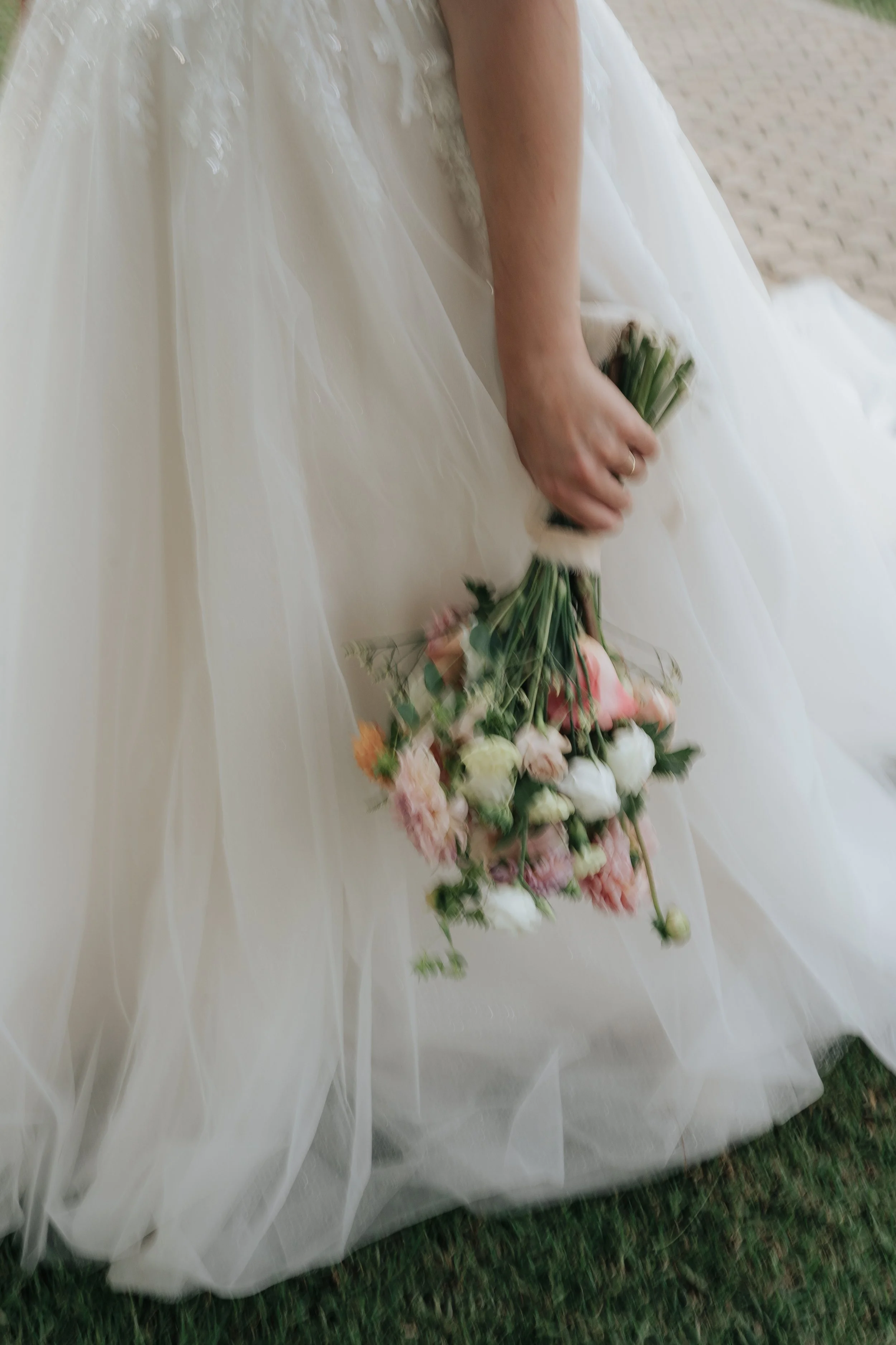 Bride holding her wedding bouquet in the Algarve
