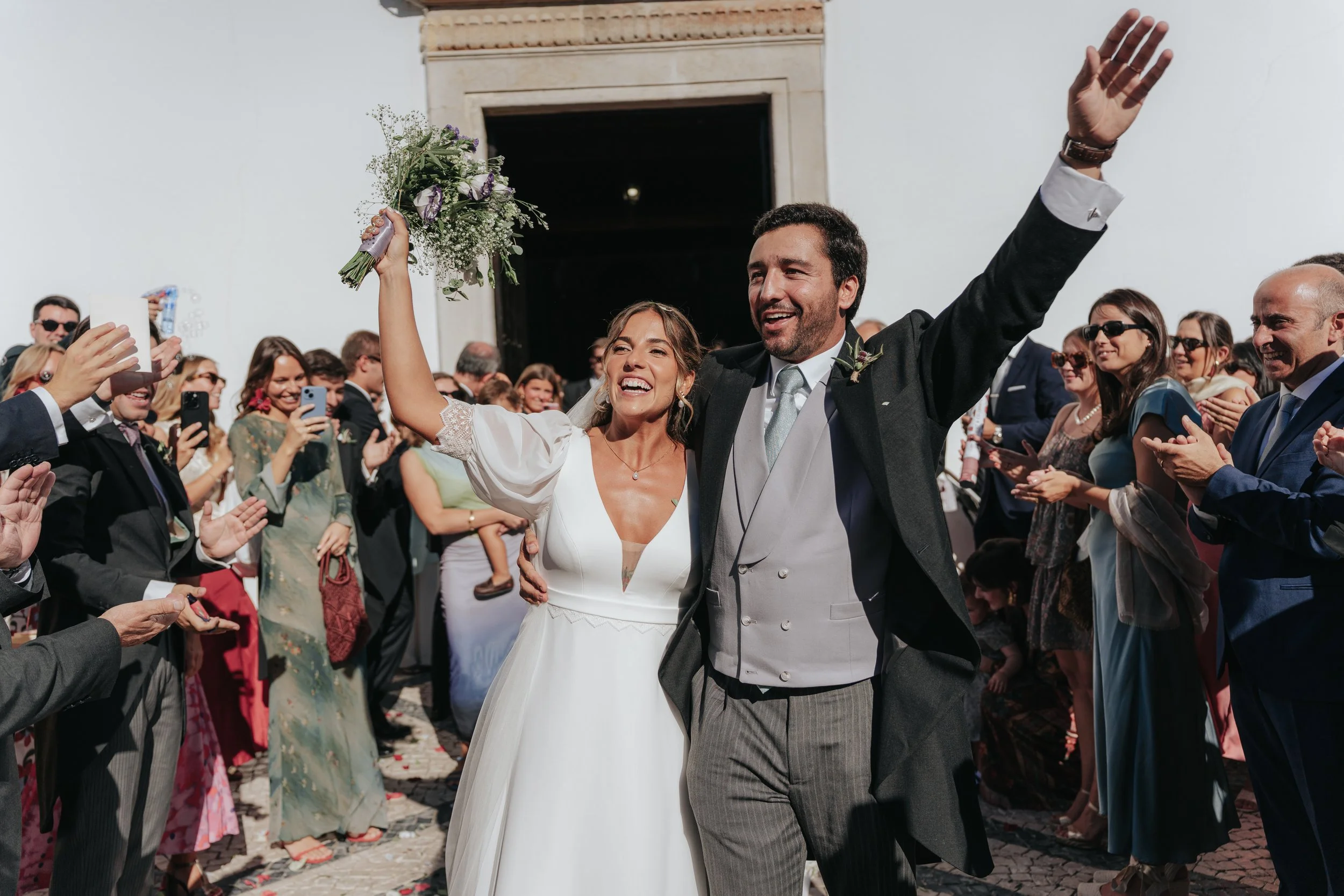Bride and groom dancing outside the church in Tavira, Algarve