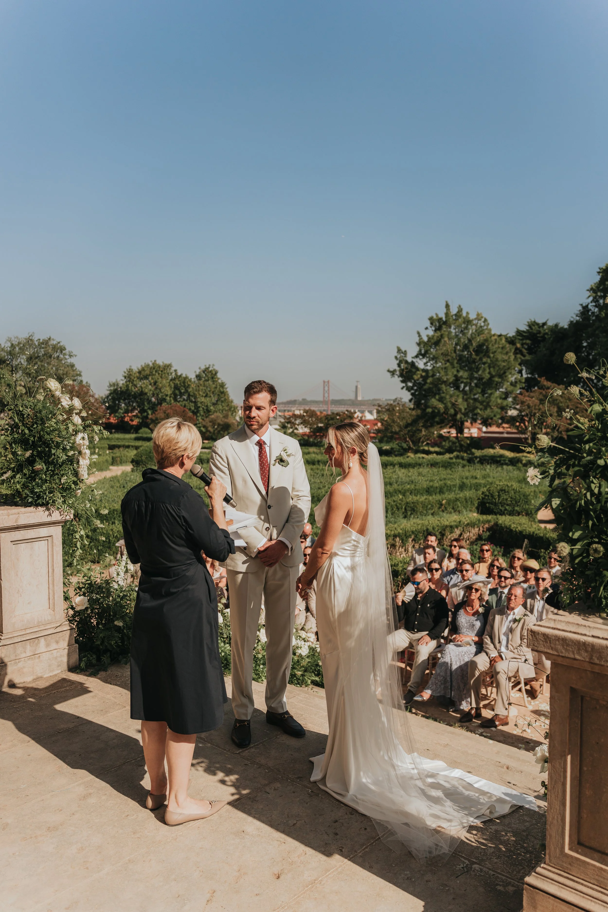 “I do” moment at Vandelli Botanical Garden with a view over the 25 de Abril Bridge in Lisbon 
