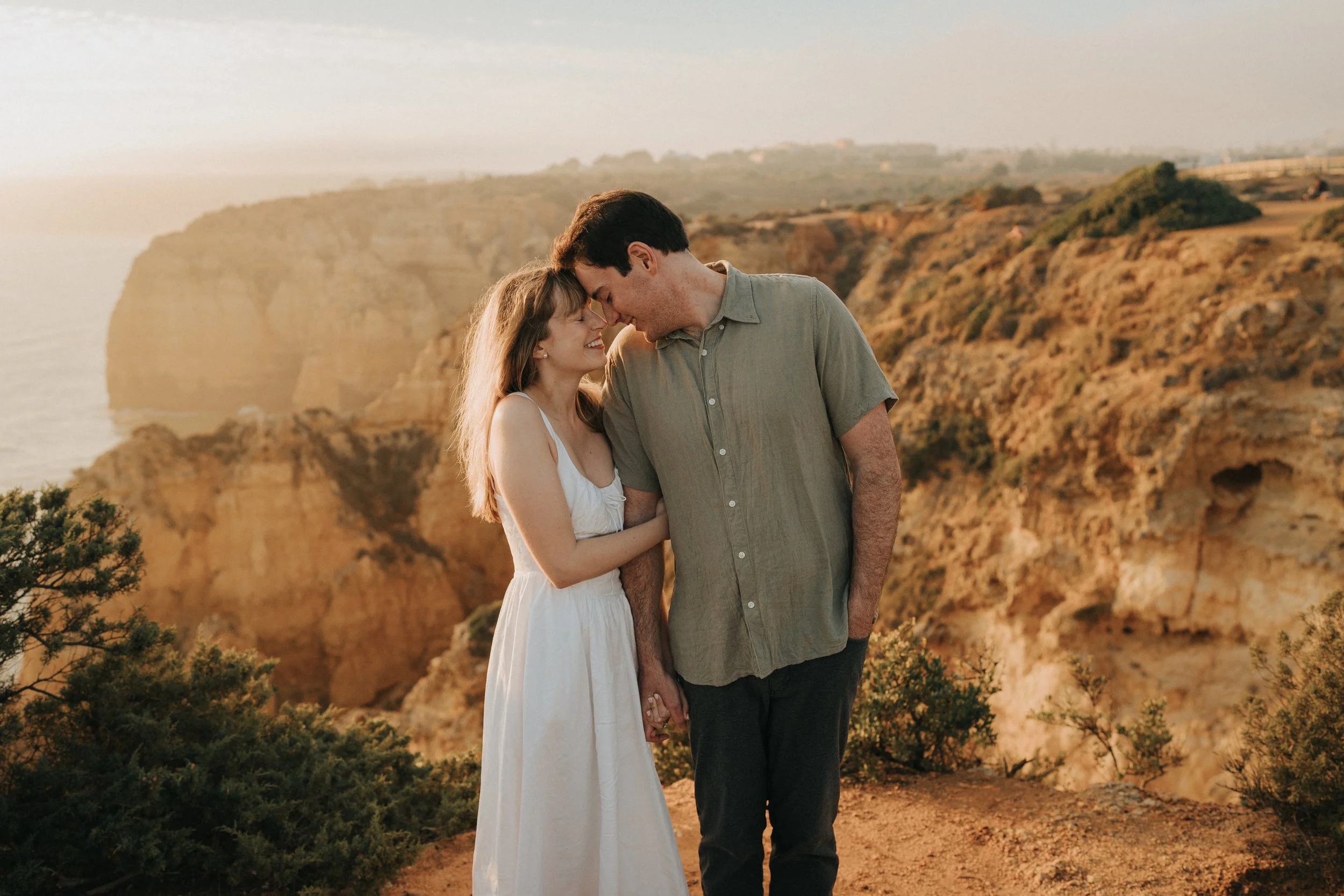 Couple smiling together at Ponta da Piedade