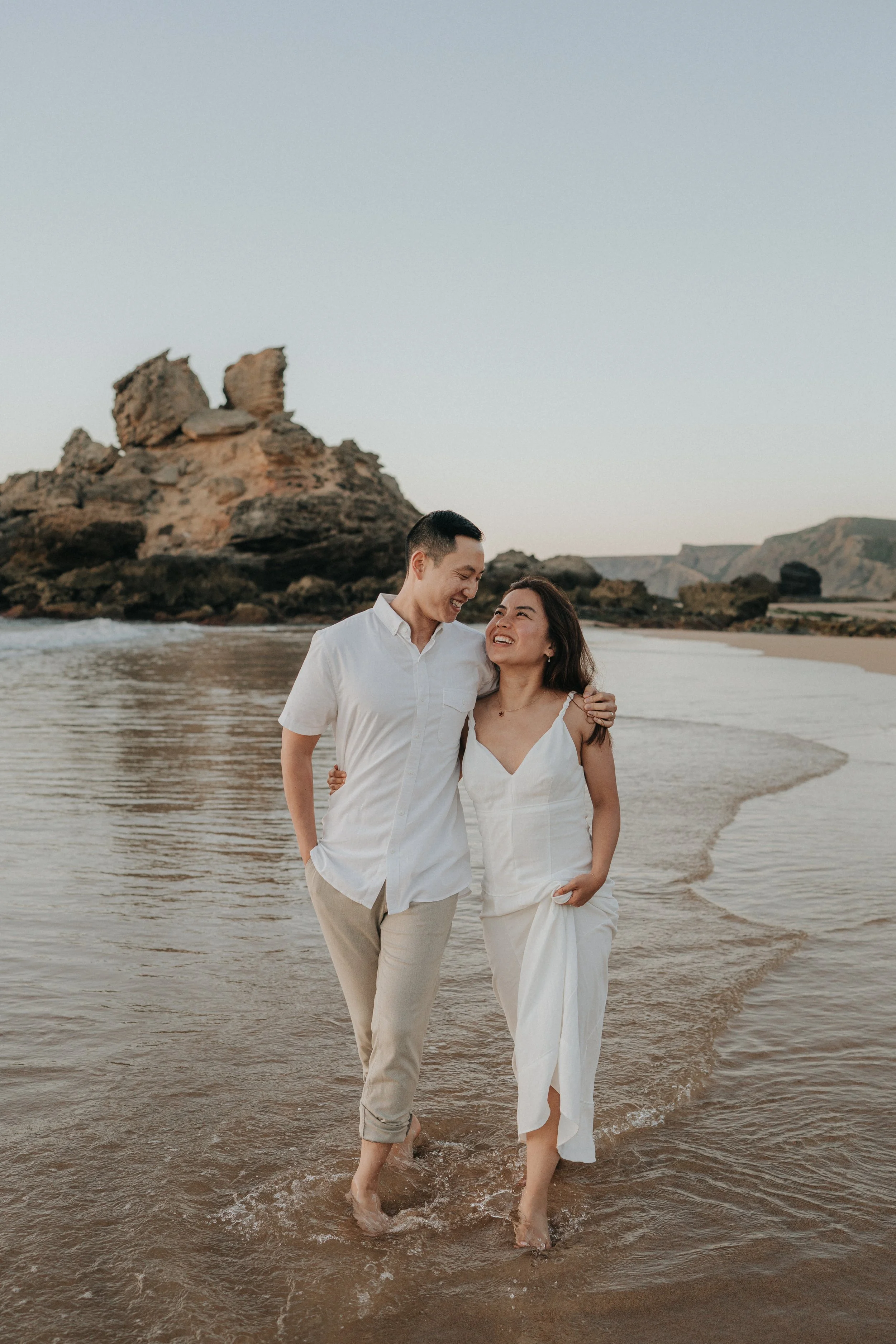 Couple walking at Praia do Castelejo